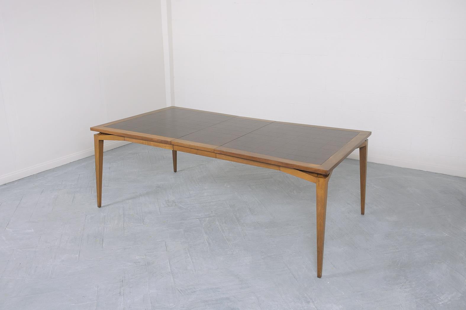 Carved Mid-Century Modern Extendable Walnut Dining Table: Timeless Elegance & Utility For Sale