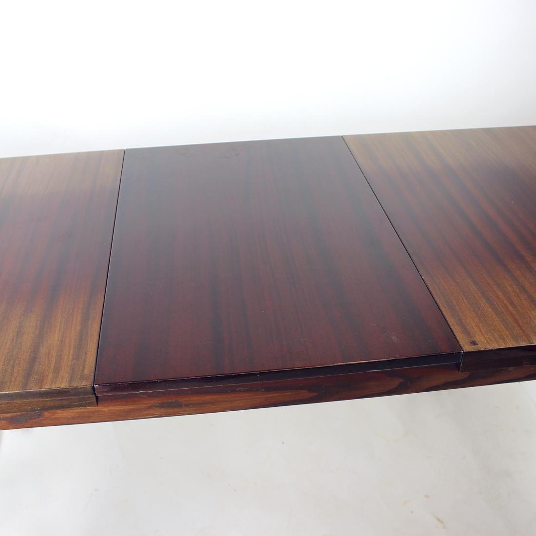 Beautiful mid-century table produced in 1960s by Jitona company. Original labels still attached on the bottom of the top boards. The table is produced in oak wood with mahogany veneer on the top board and high sheen finish. The legs are in square