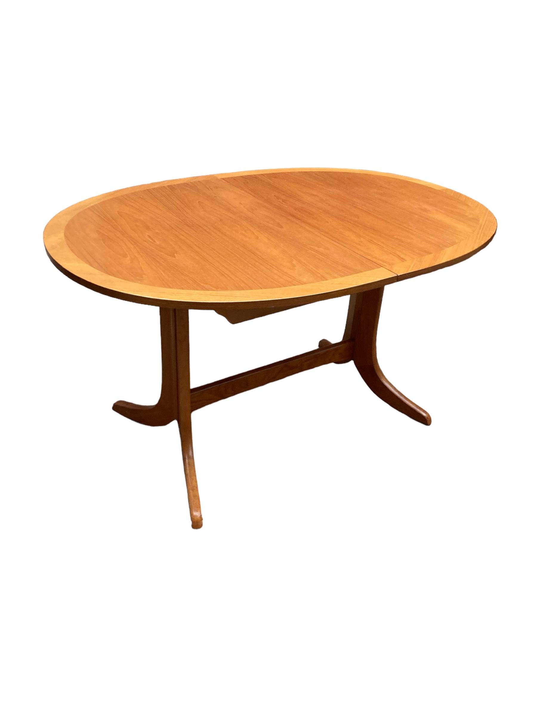 Introducing our exquisite extendable oval dining table with a beautifully crafted Teak top. This elegant piece of furniture is designed to enhance any dining space with its timeless appeal and generous size. The sturdy top not only adds warmth and