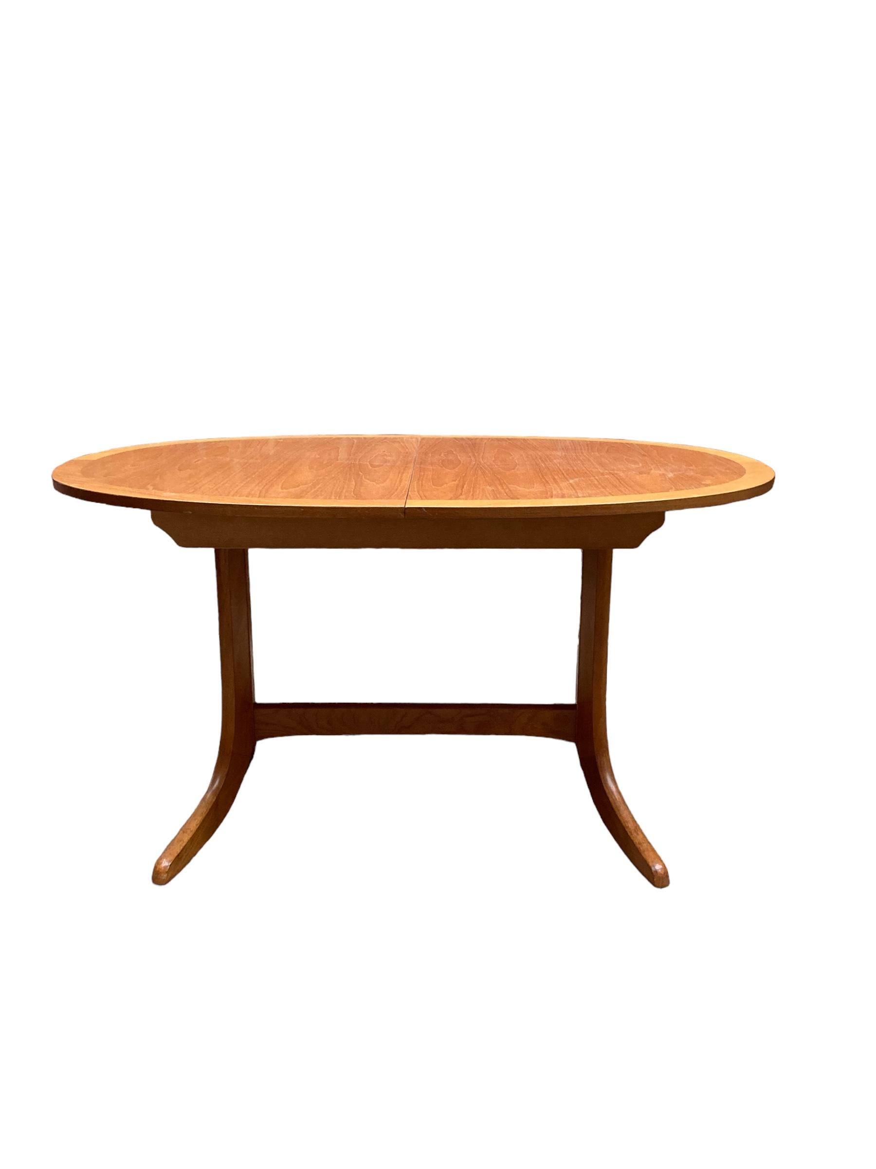 Mid-Century Modern Mid Century Extendable teak butterfly Oval dining table made by Nathan. For Sale