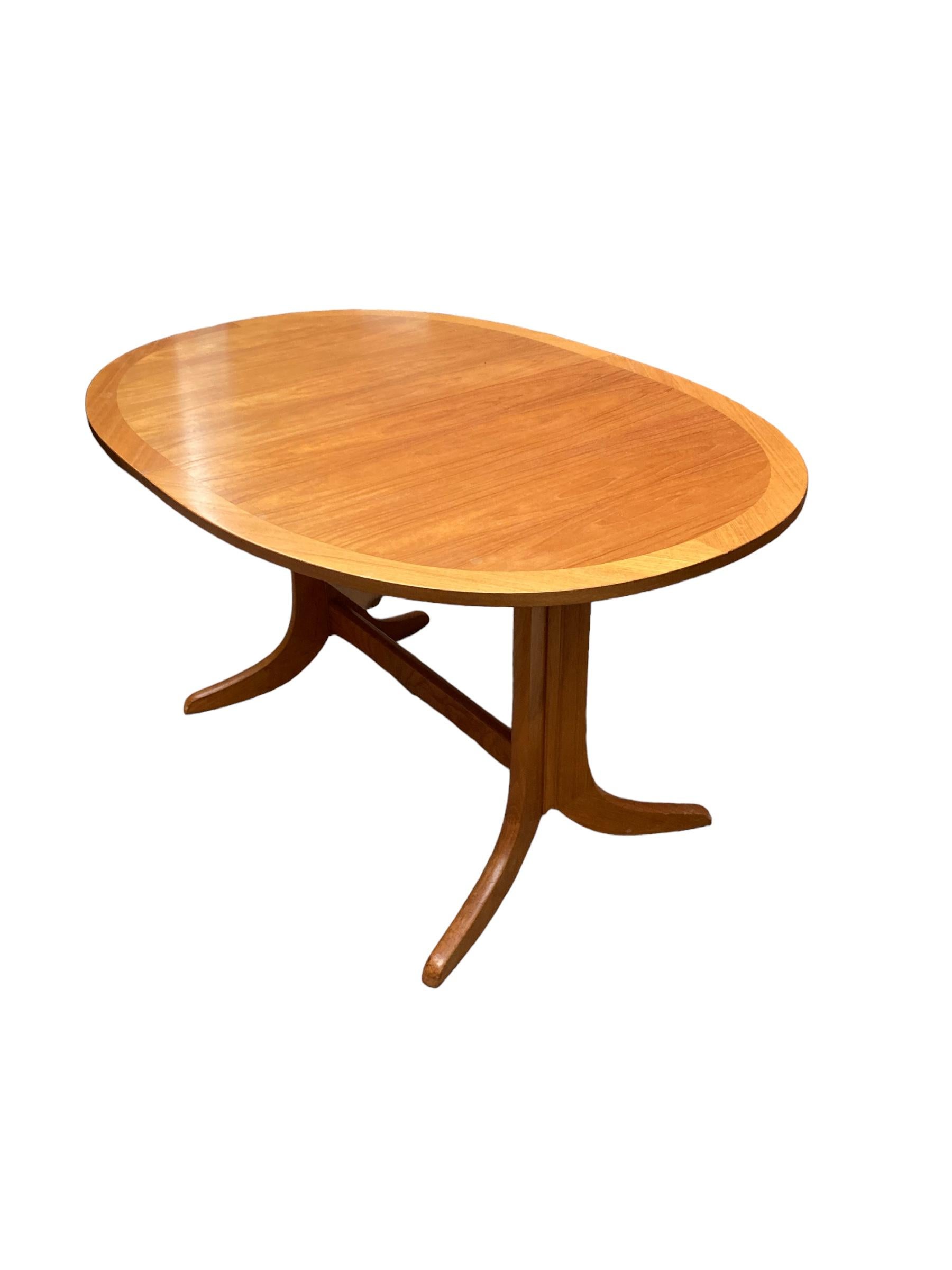 20th Century Mid Century Extendable teak butterfly Oval dining table made by Nathan. For Sale