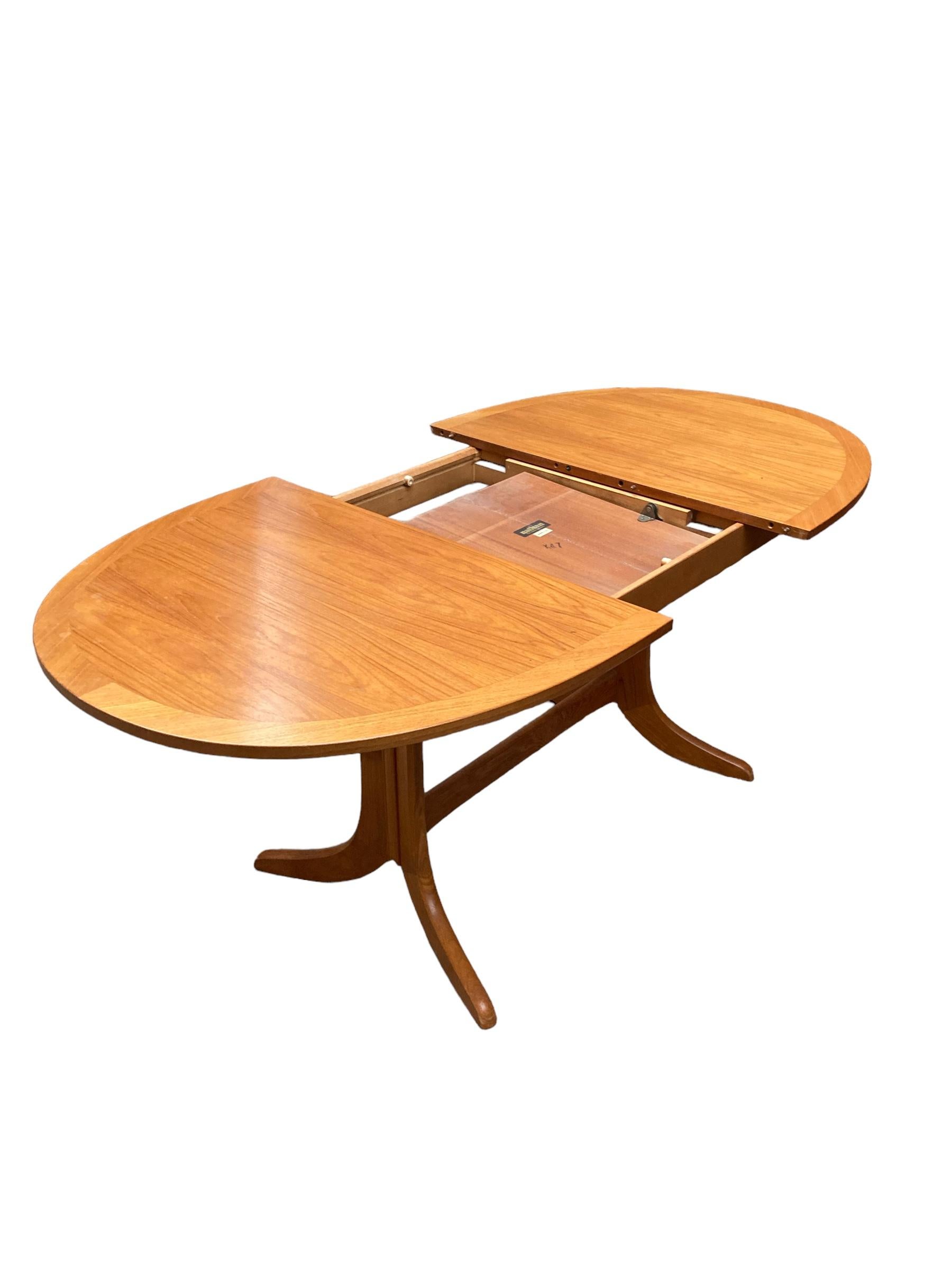 Teak Mid Century Extendable teak butterfly Oval dining table made by Nathan. For Sale