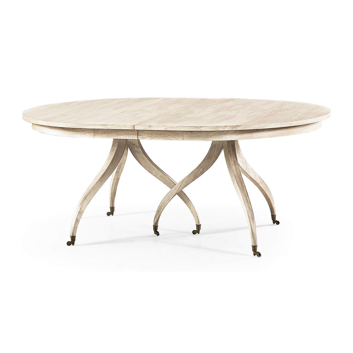 Mid century extending dining table. Inspired by an early 19th-century Regency design, this dining table is timeless and features an elegant and functional design. The oval extending table is perched atop sinuous, flowing classic spider legs with