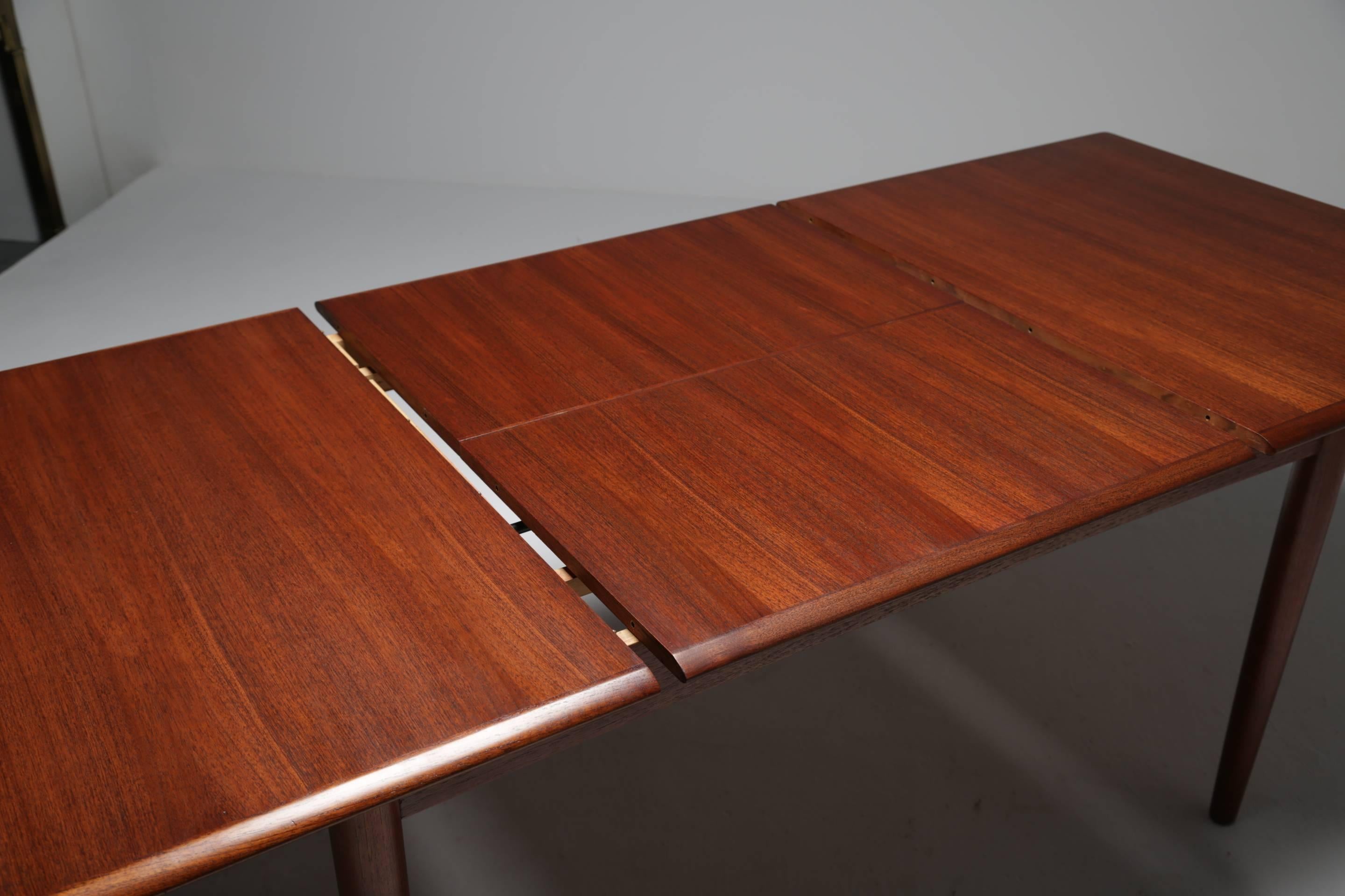 Danish Fully restored Scandinavian modern Dyrlund teak extending dining table .