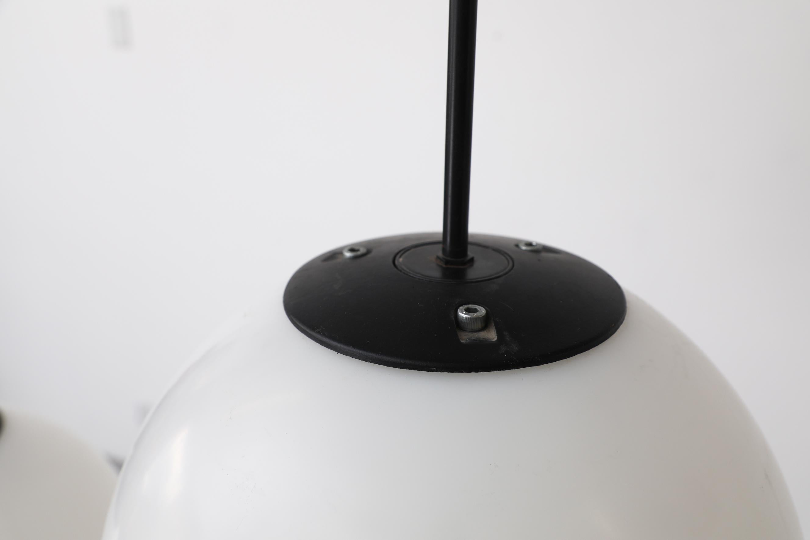 Mid-Century Extra Large Acrylic Globe Pendant Light with Black Enameled Hardware For Sale 2