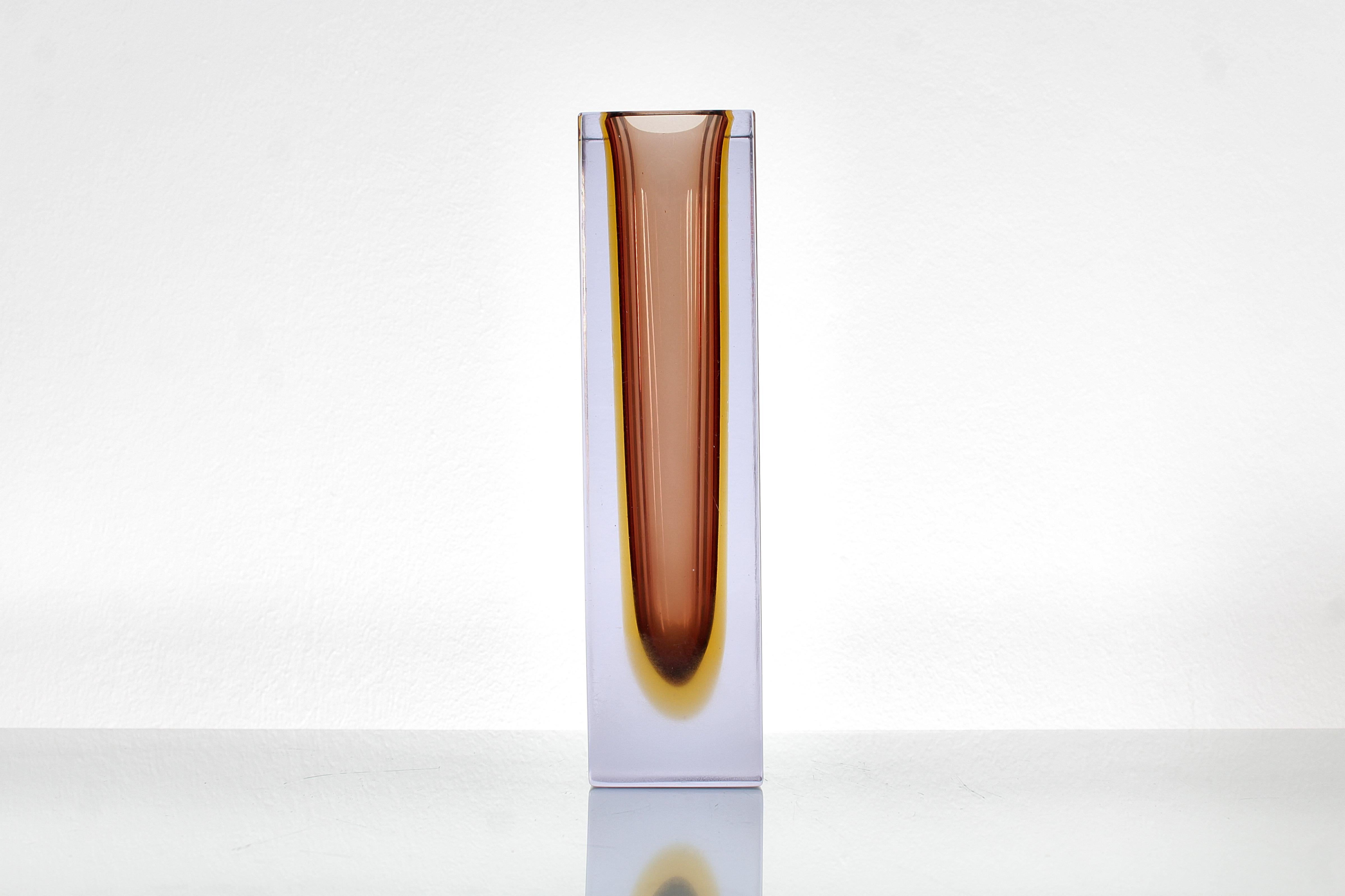 Geometric vase in transparent Murano glass with yellow-shaded submerged bronze. Attributable to Flavio Poli, Italy 1960s. Wear consistent with age and use, there are traces of dulling near the base, and some subtle chips on the edges.