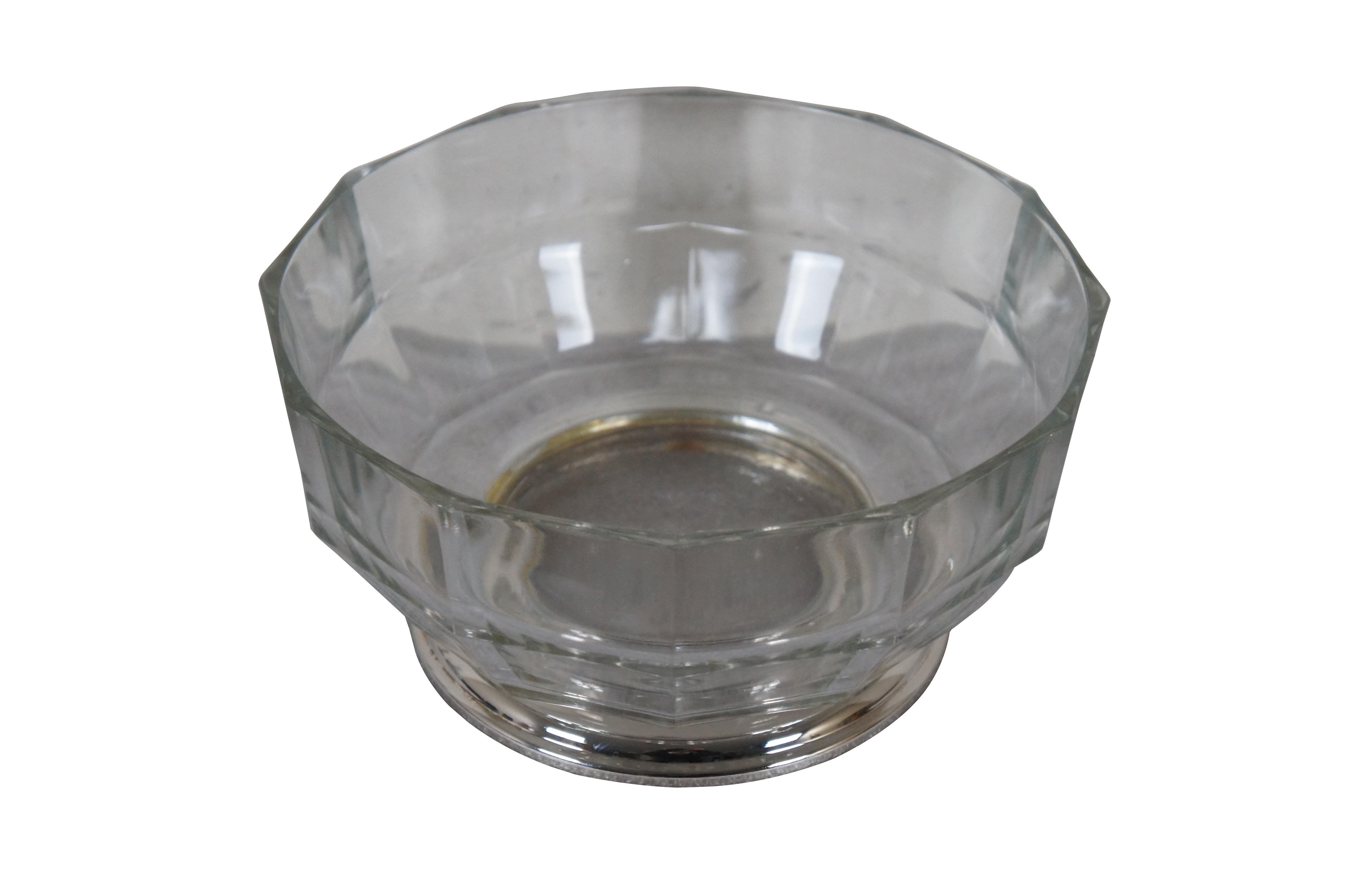 Mid to late 20th century pressed glass centerpiece / fruit bowl featuring  a mid century modern faceted design and silver plate base.

Dimensions:
9.5