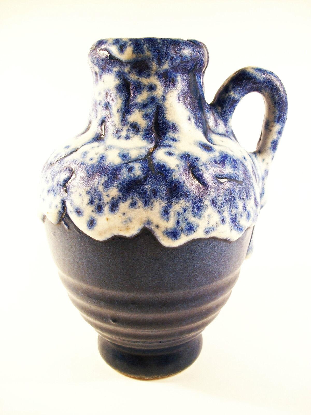 Mid Century extraordinary fat lava glaze ceramic vase/jug - indistinctly signed on the base - model number 805/46 - West Germany - circa 1950's.

Excellent vintage condition - no loss - old minor glaze chip with restoration.

Size - 4 3/4