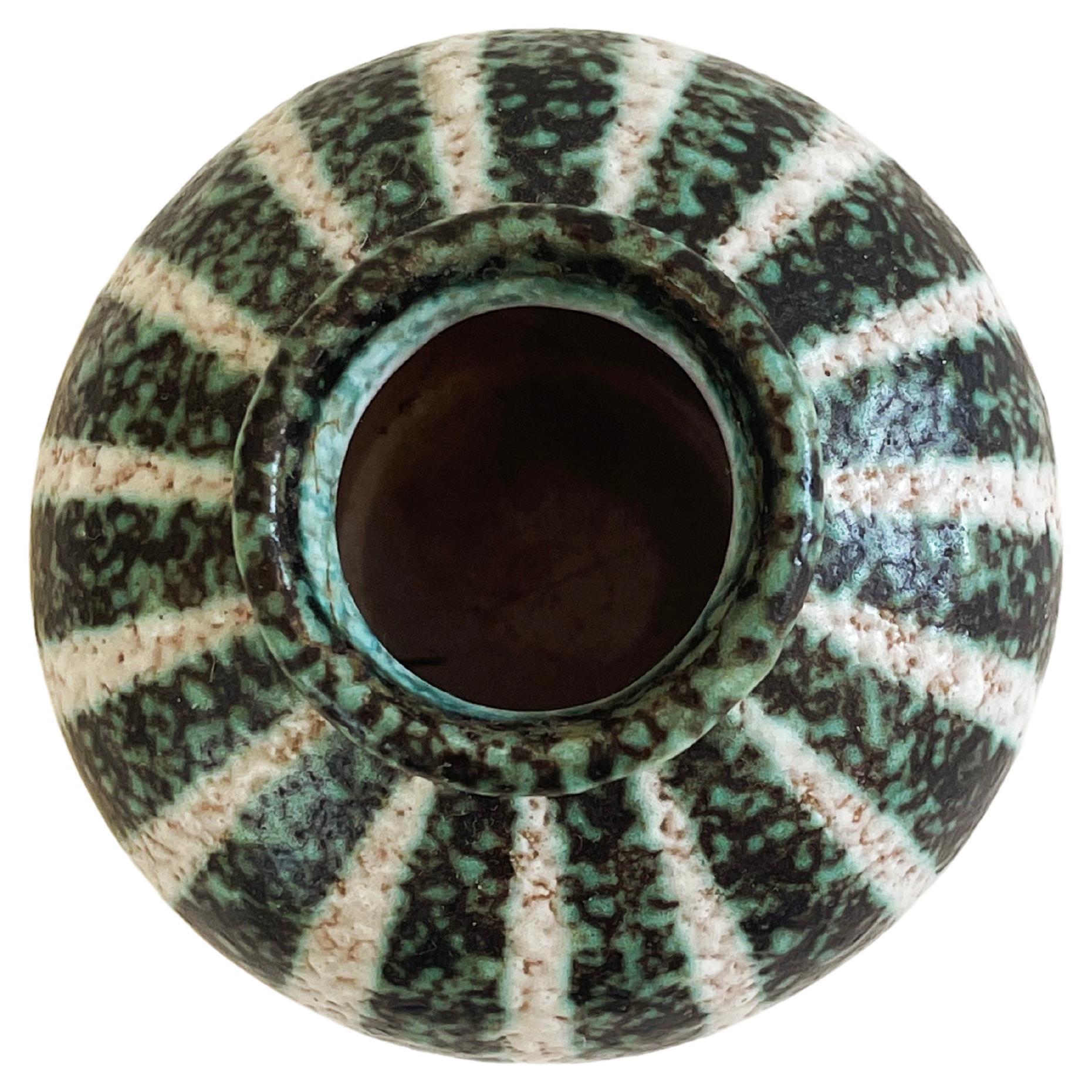 Funky zebra-pumpkin striped mid-century ceramic vase.
Executed by Kurt Tschörner, around 1960 for Ruscha, Western Germany. 
Bubbly Fat Lava glaze in a green-black & natural white with the light brown base ceramic shining through.
Hand painted and