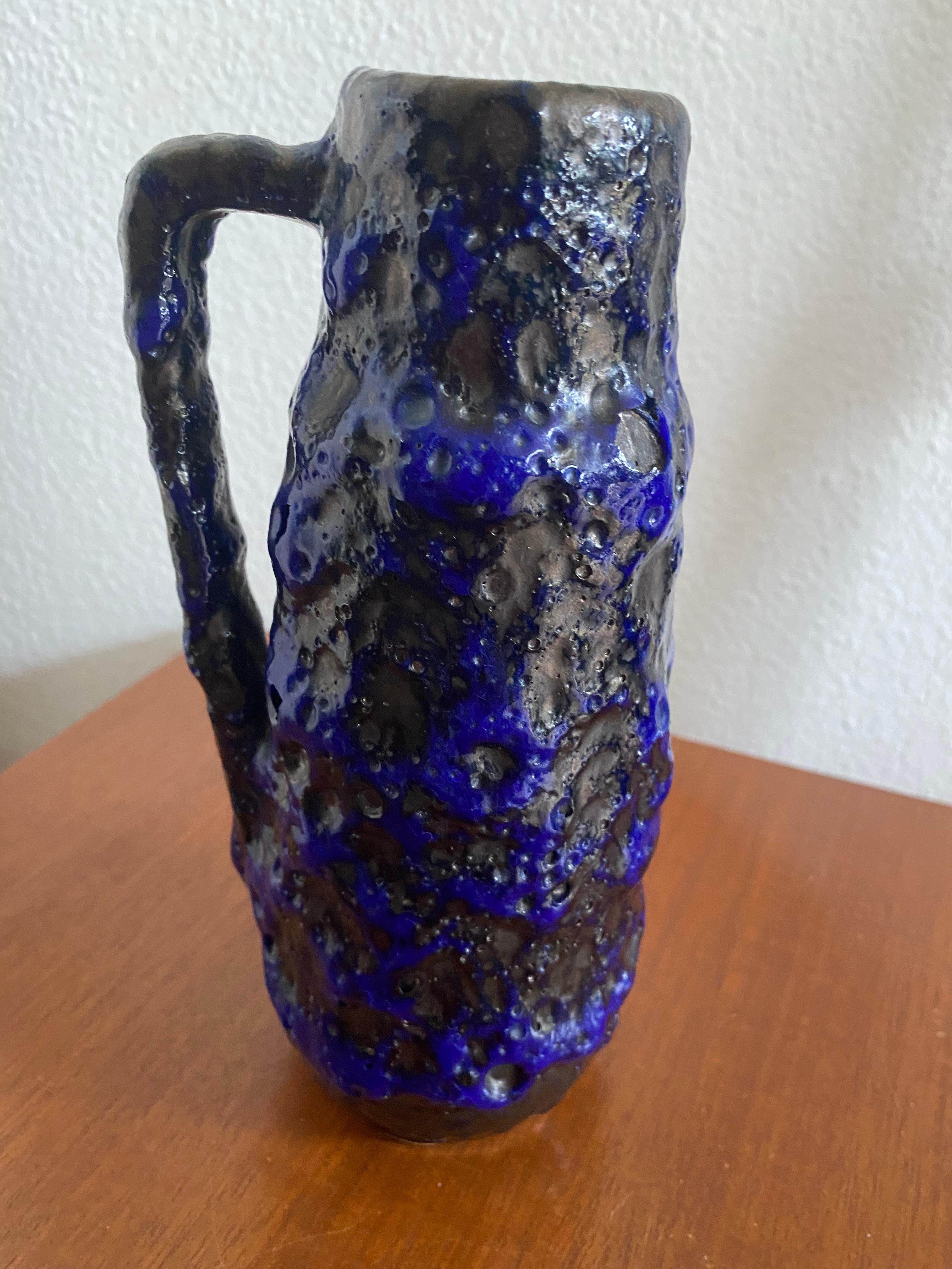 A vibrant blue and grey Fat Lava vase by Scheurich Keramik. The lava on this vase is quite thick.

