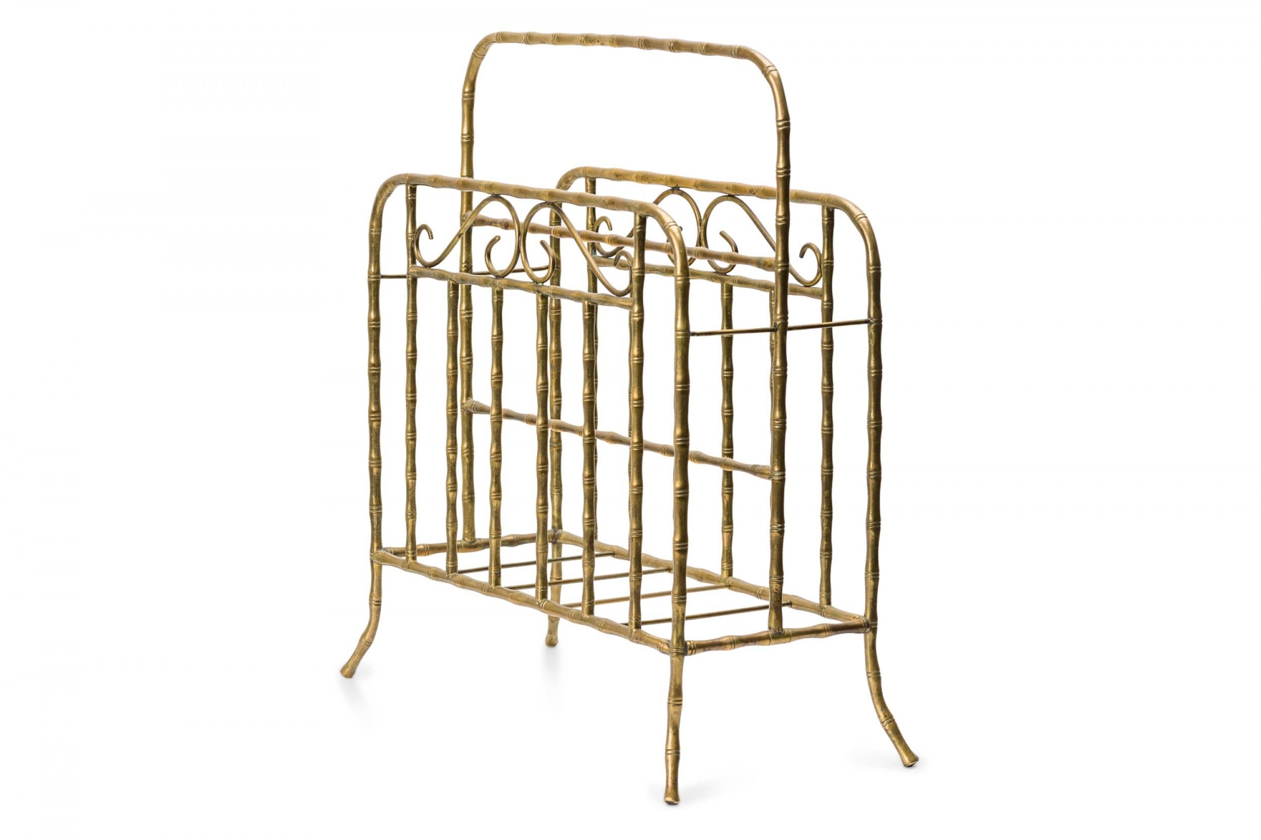 Mid-Century faux bamboo brass magazine stand with two compartments, a central handle, and four curved feet.
