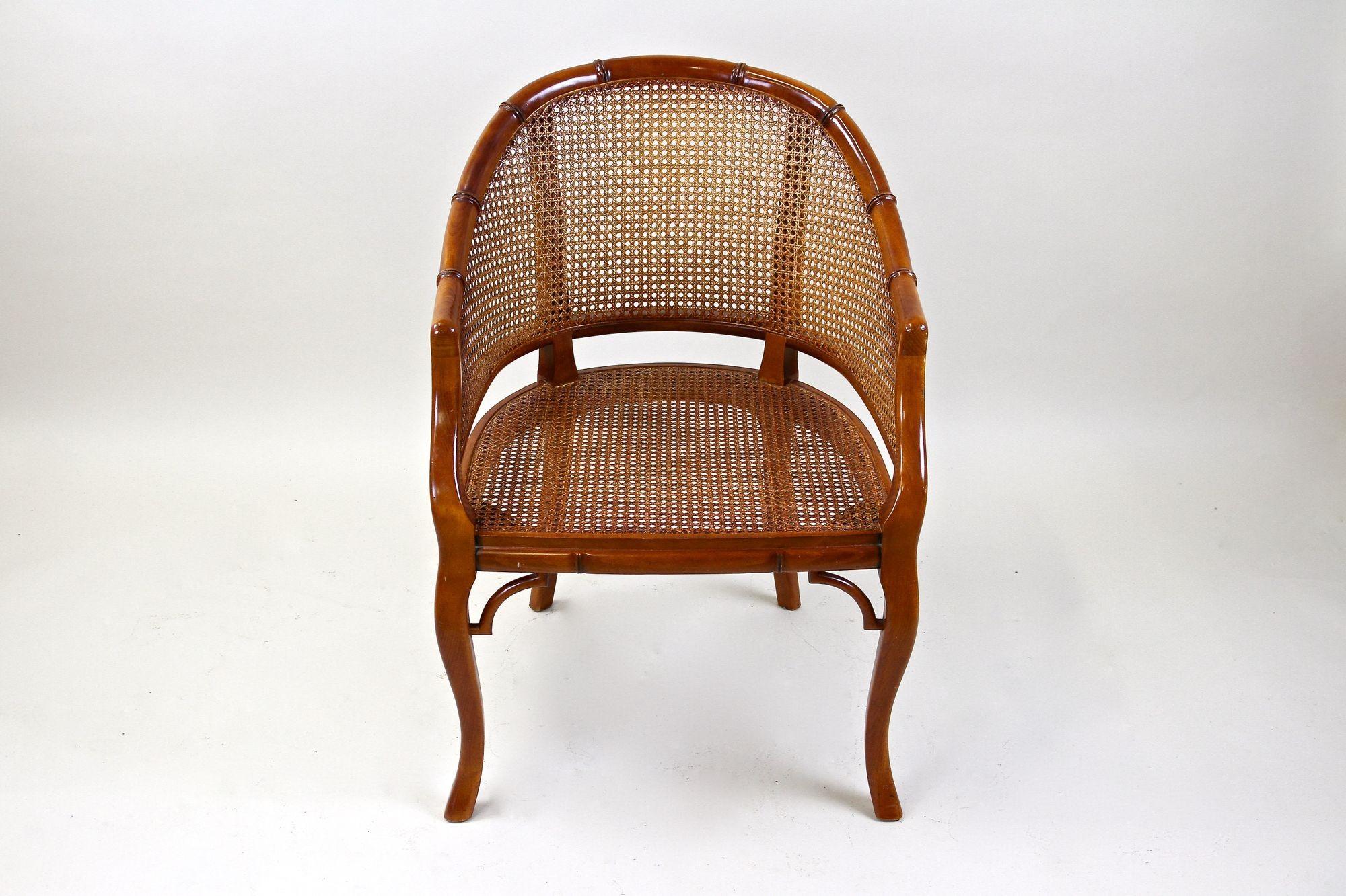 Spectacular Mid-century faux-bamboo caned barrel armchair from the 1970s in France made by the famous company of Grange, a very traditional French furniture company established 1904 in Monts du Lyonnais by Joseph Grange. This stunning late