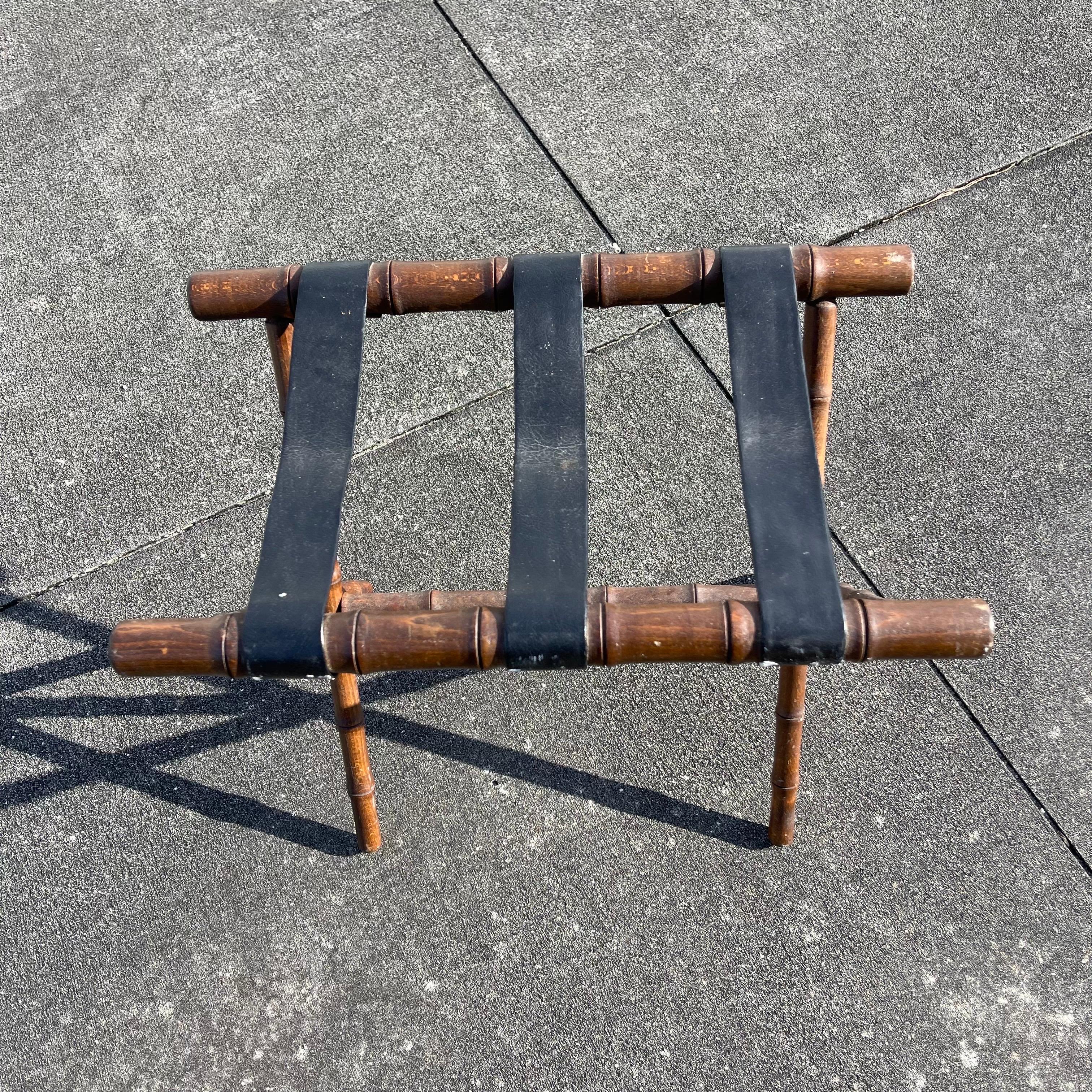 Classic faux bamboo folding luggage rack.