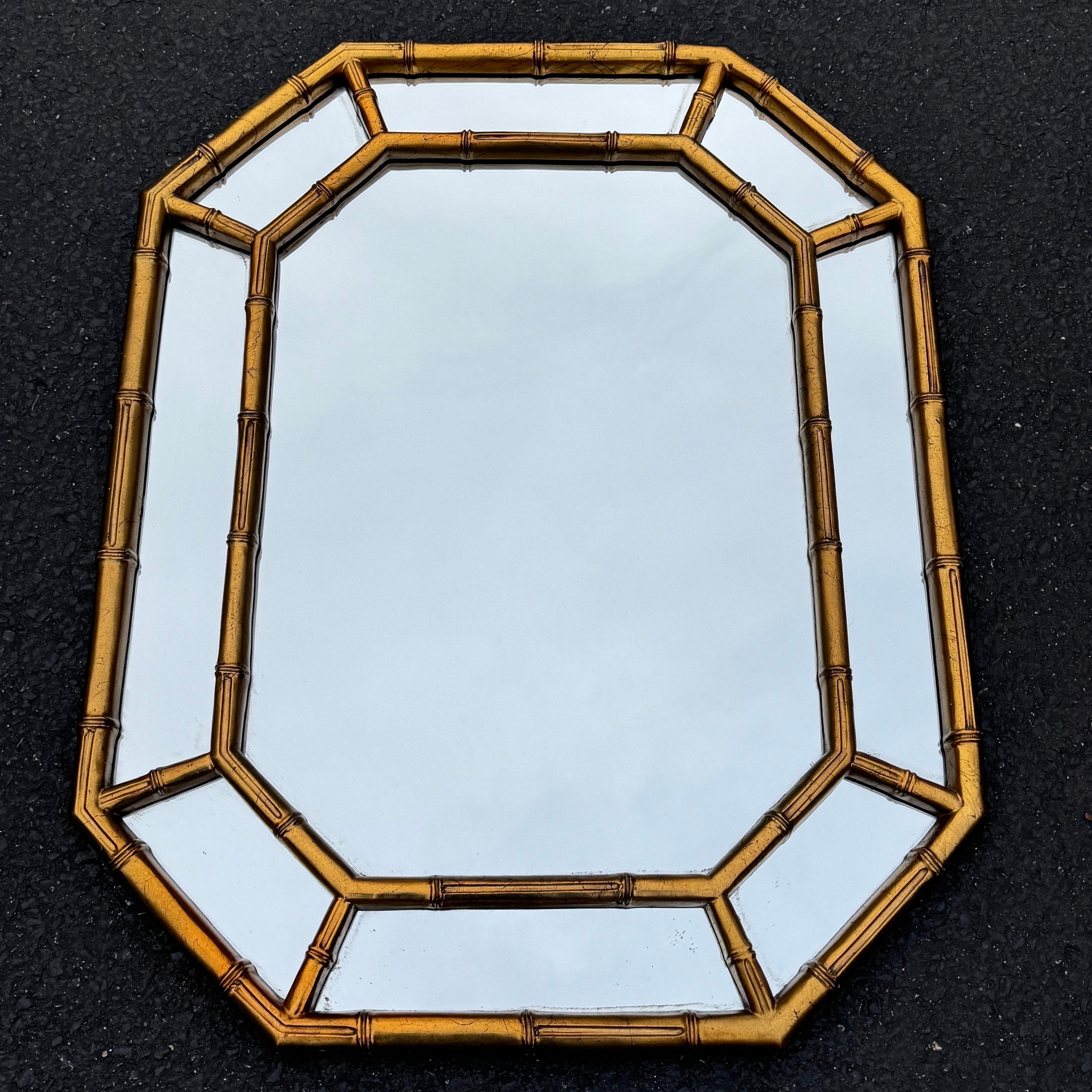 Impressive octagonal gold MCM mirror. Mirror can hang in a horizontal or vertical position. This very sturdy wood mirror is certainly a versatile piece that can be used in a living room, dining room or powder room. 