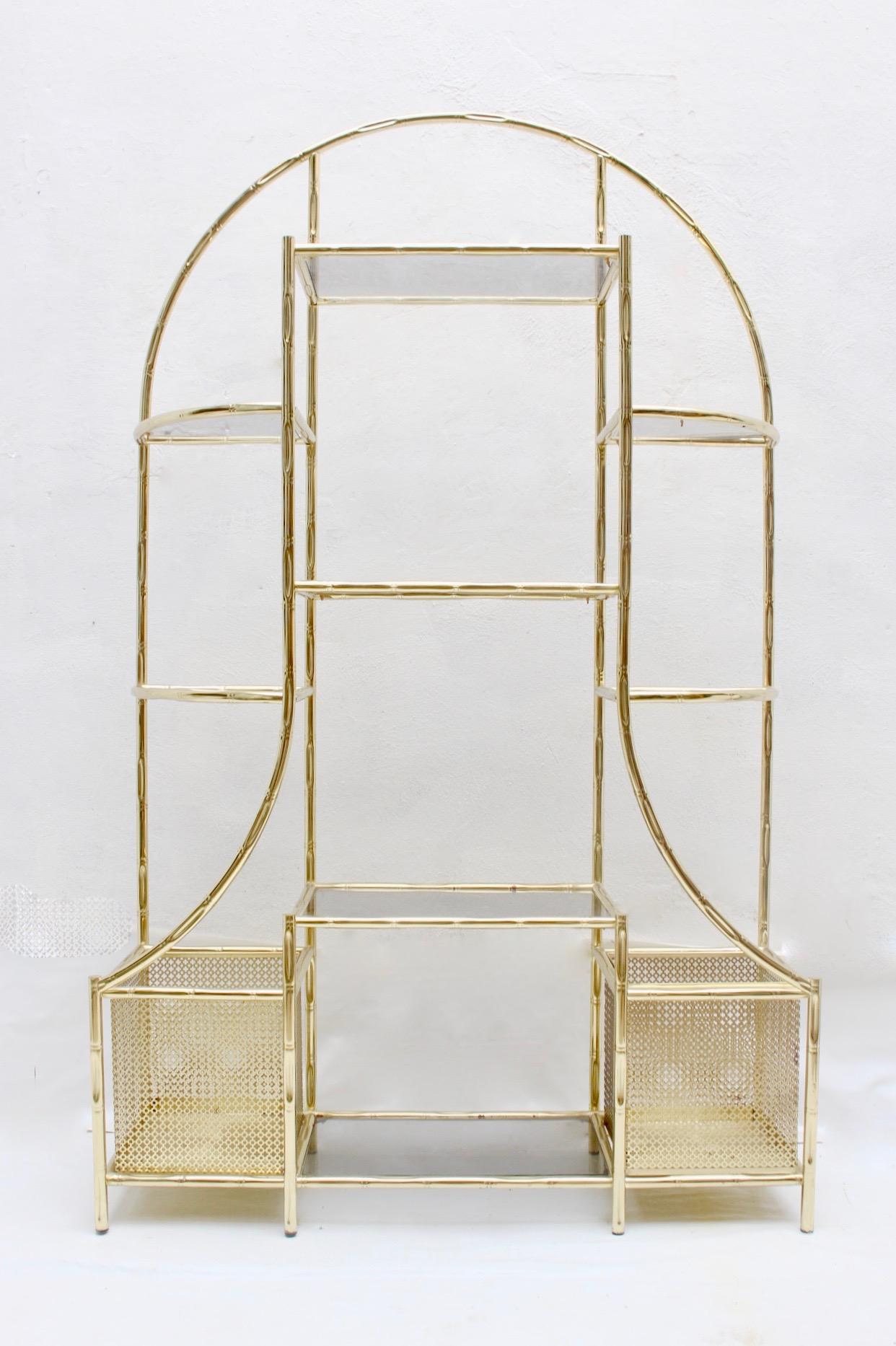 Midcentury faux bamboo étagère. Iron and smoked glass, Spain, 1970s.
With two side baskets, which can be used as planters, magazine rack, etc...
Very good condition with very light wear.