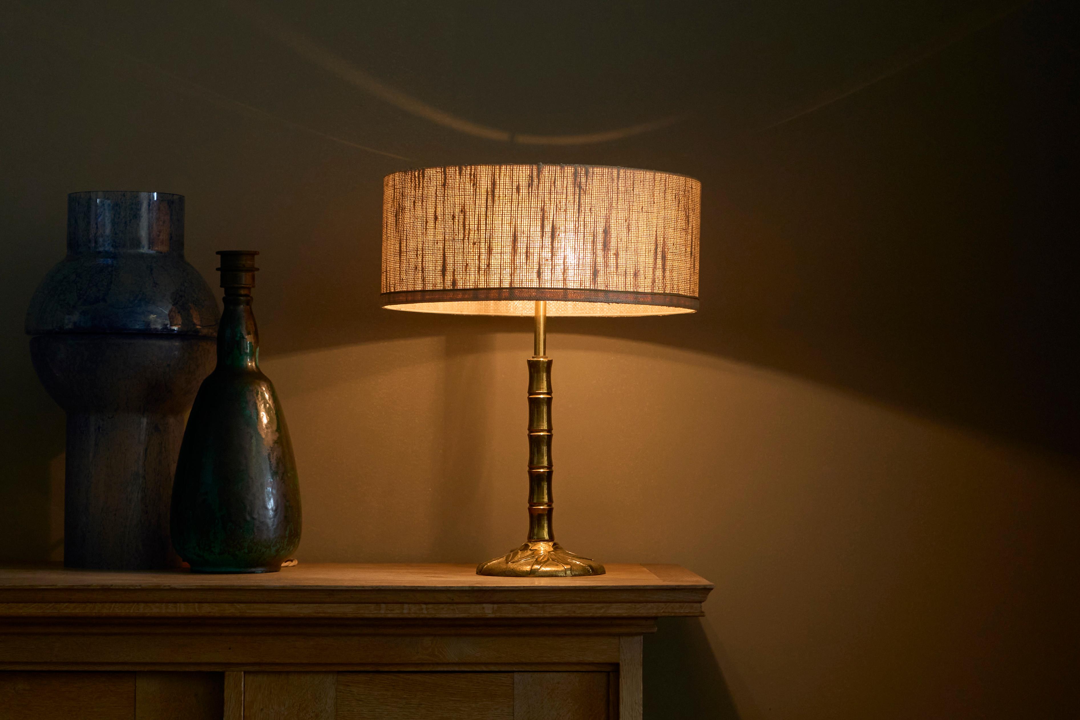 Mid Century 'Faux Bamboo' Table Lamp in Sand Cast Brass

A true gem, this is. A 1960s table lamp in sand cast brass with the original fabric shade. It features a very distinct faux bamboo design in nicely patinated cast brass. Strongly resembles