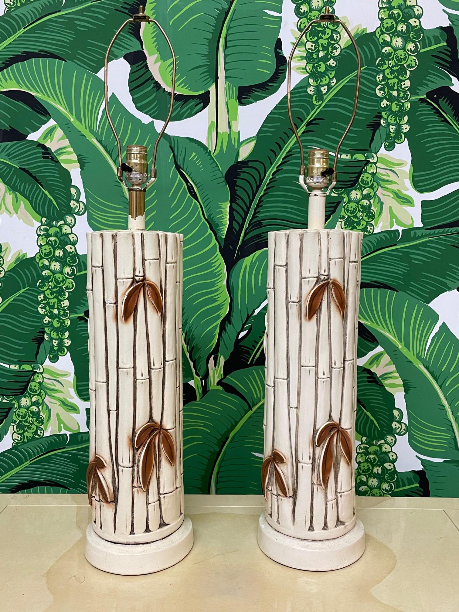 Pair of vintage table lamps in faux bamboo style. Ceramic/plaster composition. Very good condition with only very minor imperfections consistent with age. May exhibit scuffs, marks, or wear, see photos for details.

 