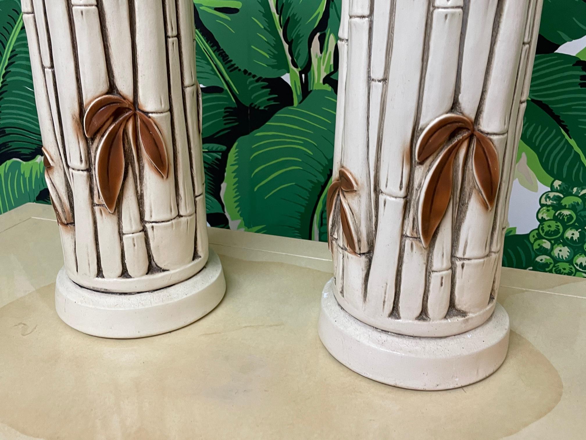 Pair of vintage table lamps in faux bamboo style. Ceramic/plaster composition. Very good condition with only very minor imperfections consistent with age.