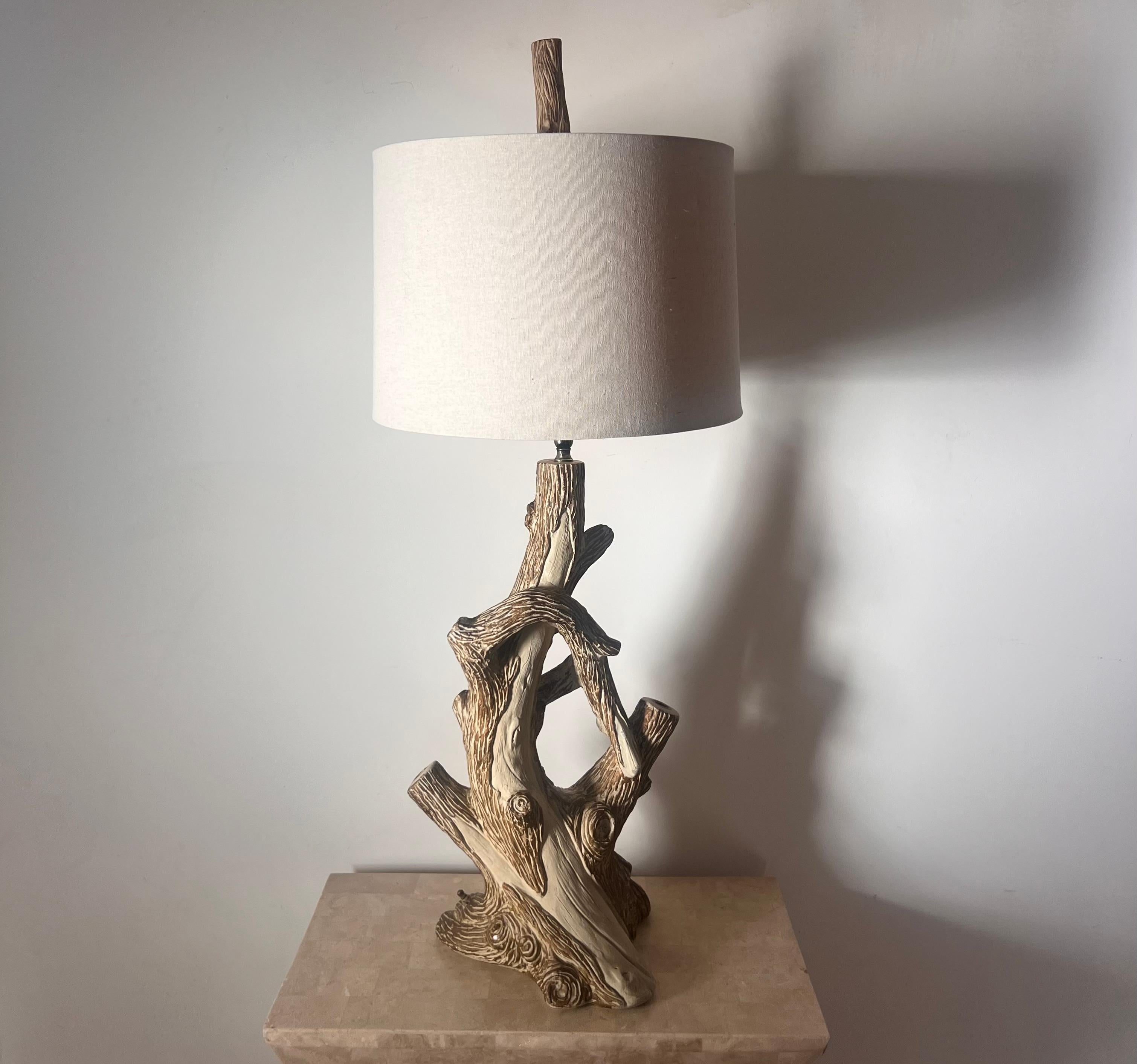 A rare faux bois branch lamp with three sockets, circa early 1960s. Note the finial is also faux bois (as shown in the photos). Shade is linen and not original. Minor signs of age; works like a dream - there is a brass knob at the base of the “wood”