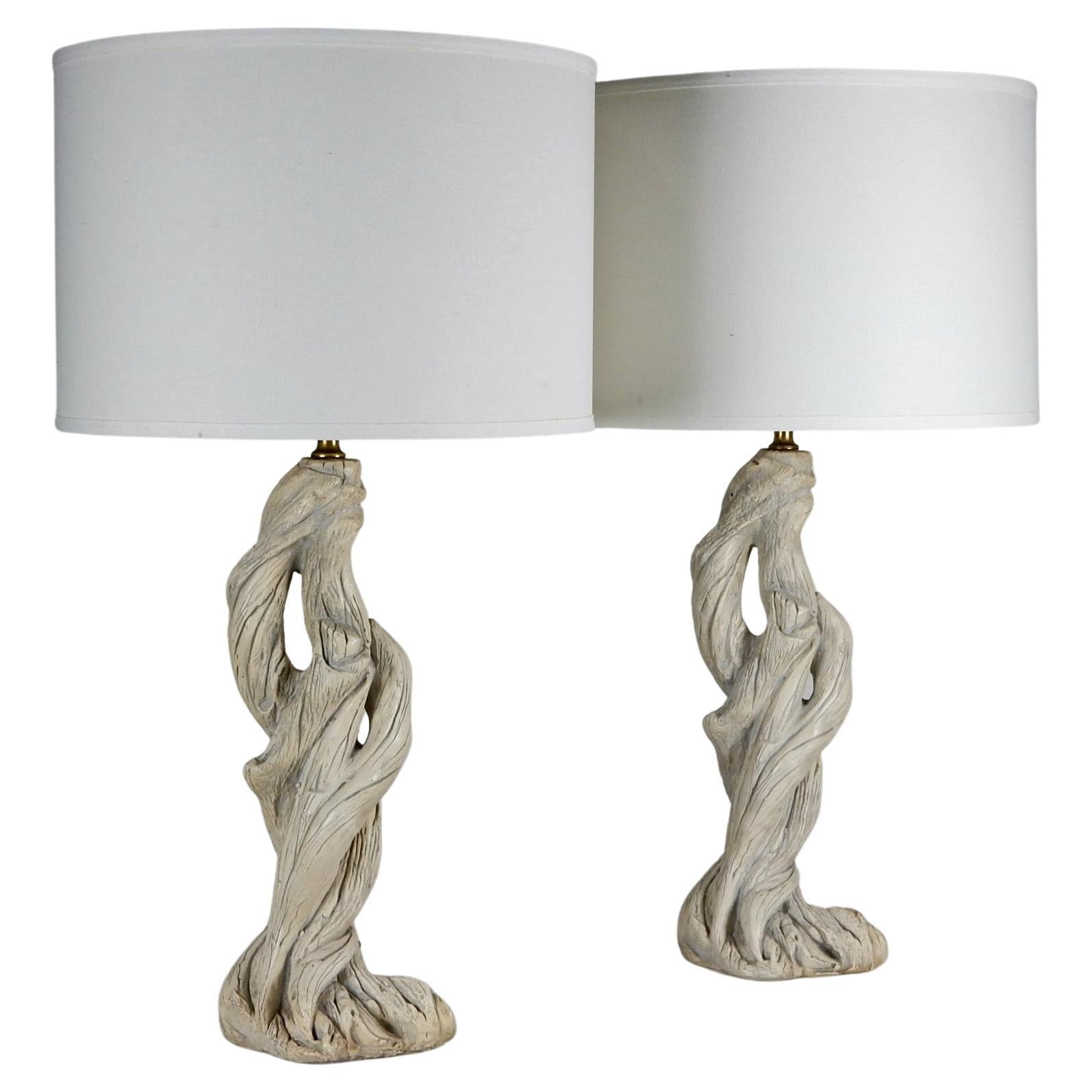 Fabulous pair of Faux Bois table lamps in the design style of Serge Roche.
They are a true real likeness to natural driftwood.
Circa 1960's. They are in original condition
including wiring. No repairs or cracks.
Shades pictured not included.