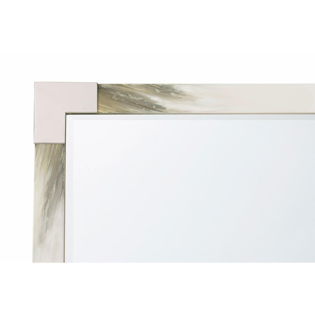 A hand-painted faux horn wooden frame with a beveled glass mirror plate. Each corner is bound in a stainless steel clasp.

Dimensions: 35.75