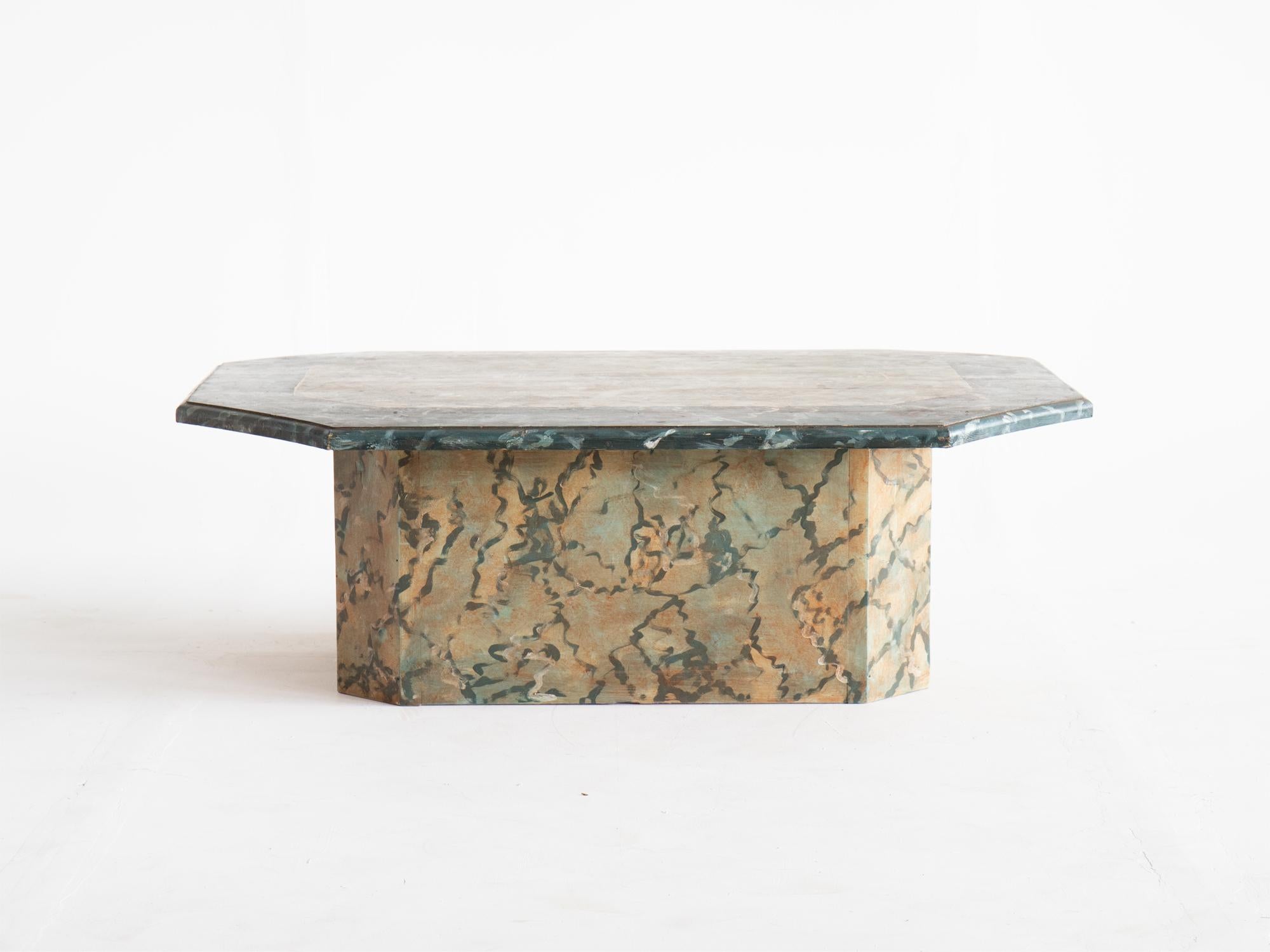 A painted pine two-tone faux marble coffee table of octagonal form, circa 1980.