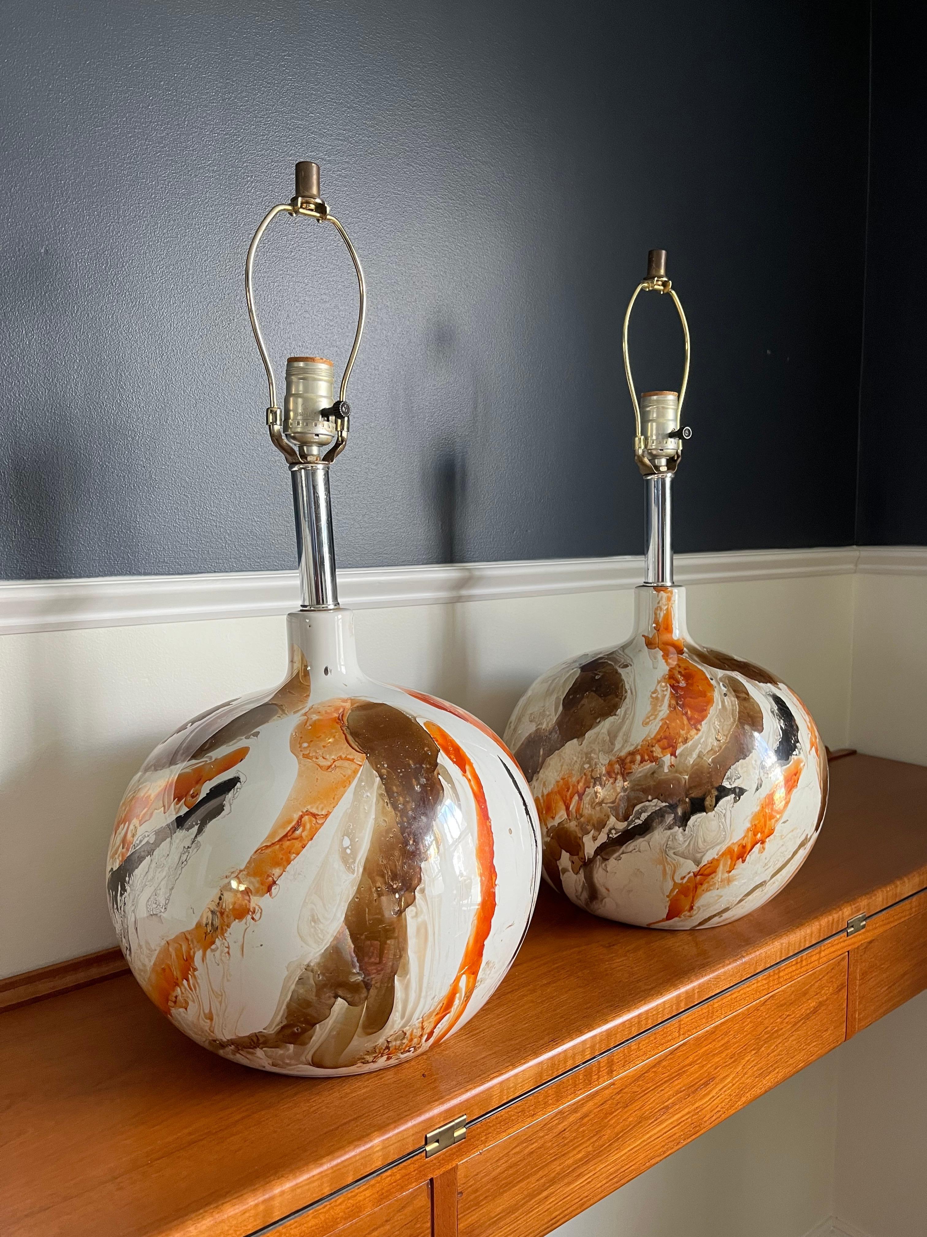 Pair of spectacular mid century glazed lamps. Faux marble design with great coloring and movement. Unique round form. 
Curbside to NYC/Philly $300