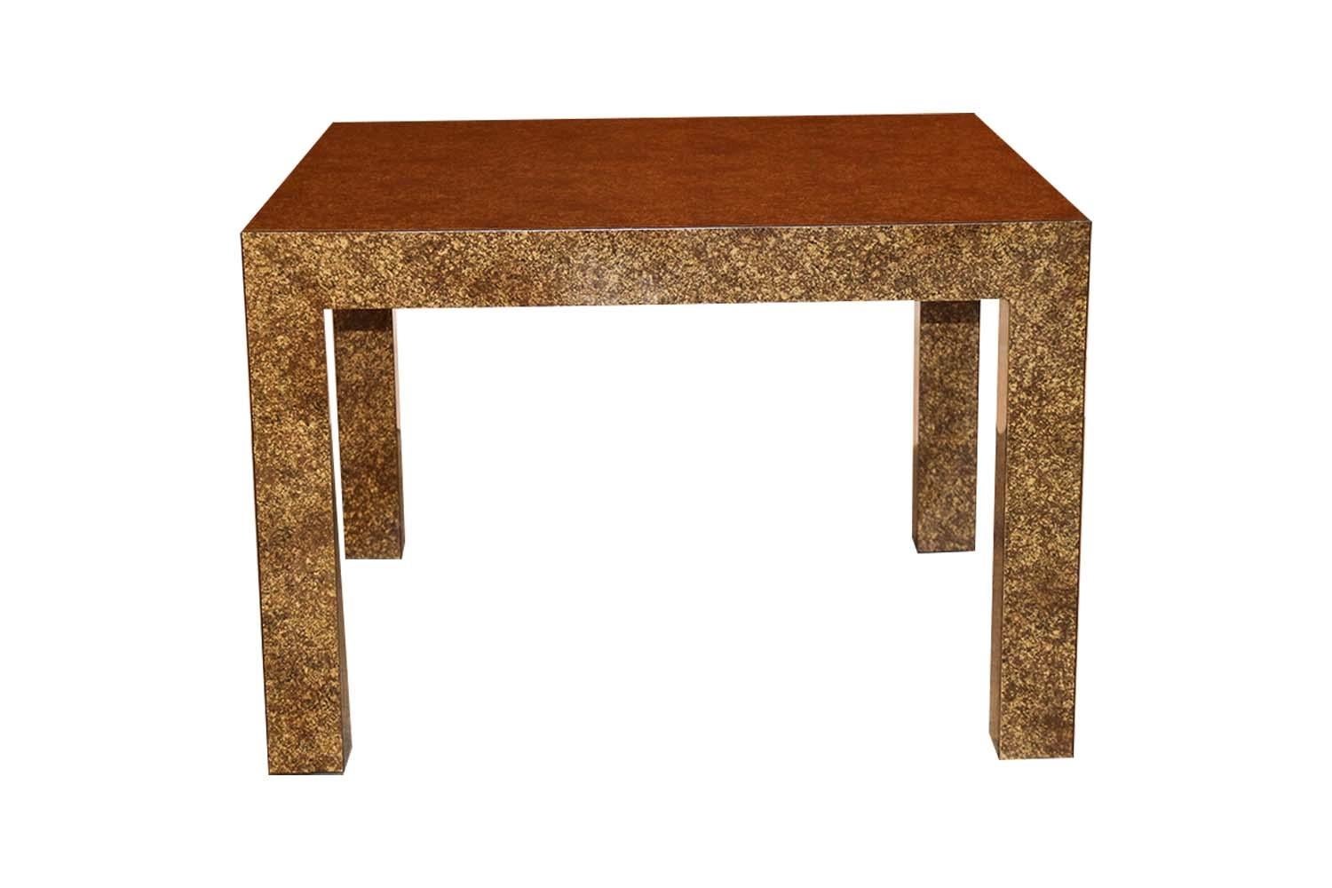 An elegant, sleek Parsons, style, coffee end/ game table, in the style of Milo Baughman, by Lane. Features faux tortoise shell oil drip finish stylish striking design on the square table top showcasing the faux tortoiseshell painted finish. Finely