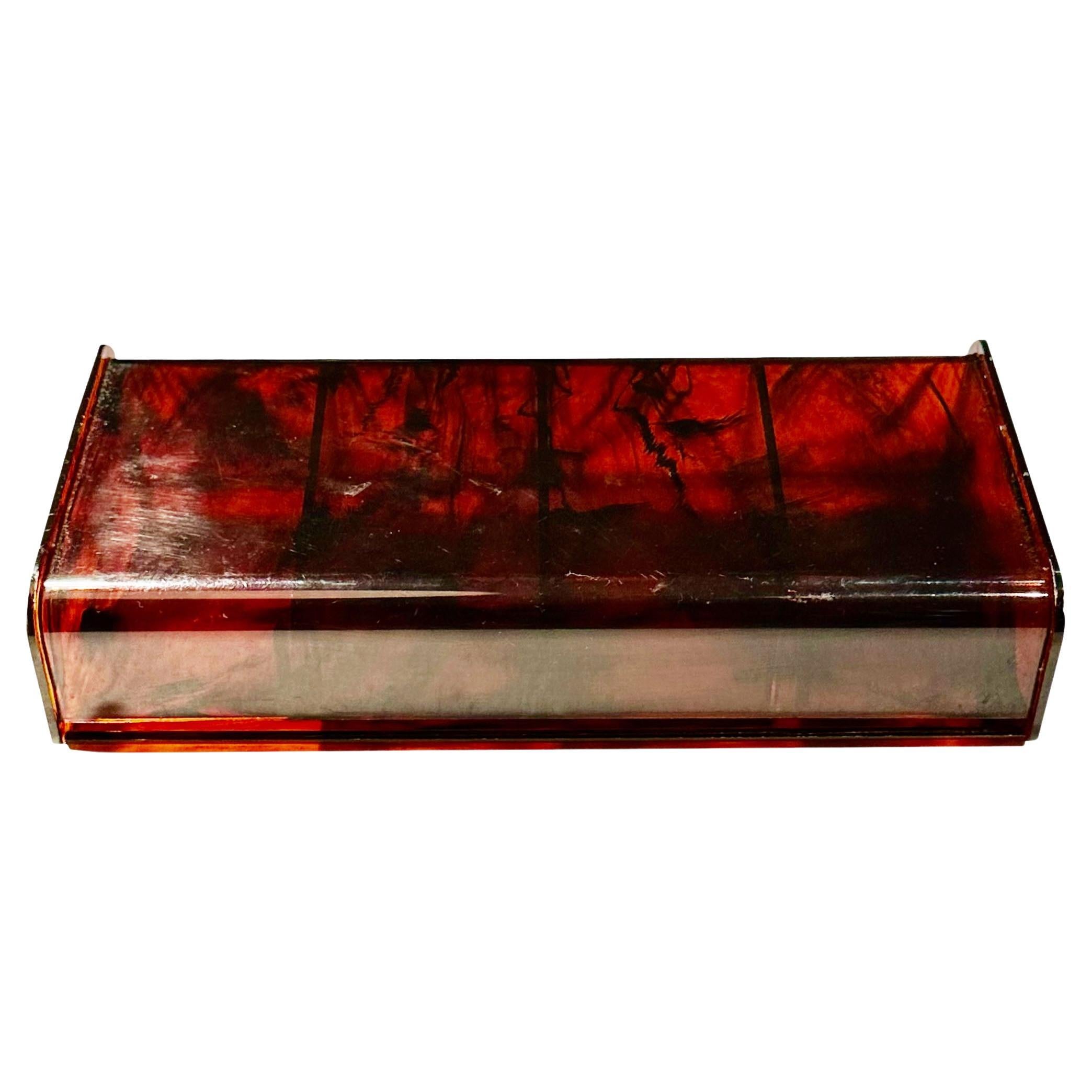 A wonderful 1950s Faux Tortoiseshell Lucite box with detachable compartments. A great addition to any lucite collection.