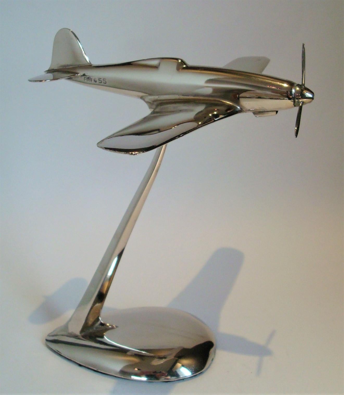 Mid-century fiat G.55 WW2 Italian fighter aircraft desk model. ca 1940´s 
Chrome plated metal desk airplane model. The airplane can be removed from the base or changed of positions. Excellent conditions. Perfect decoration to any italian style