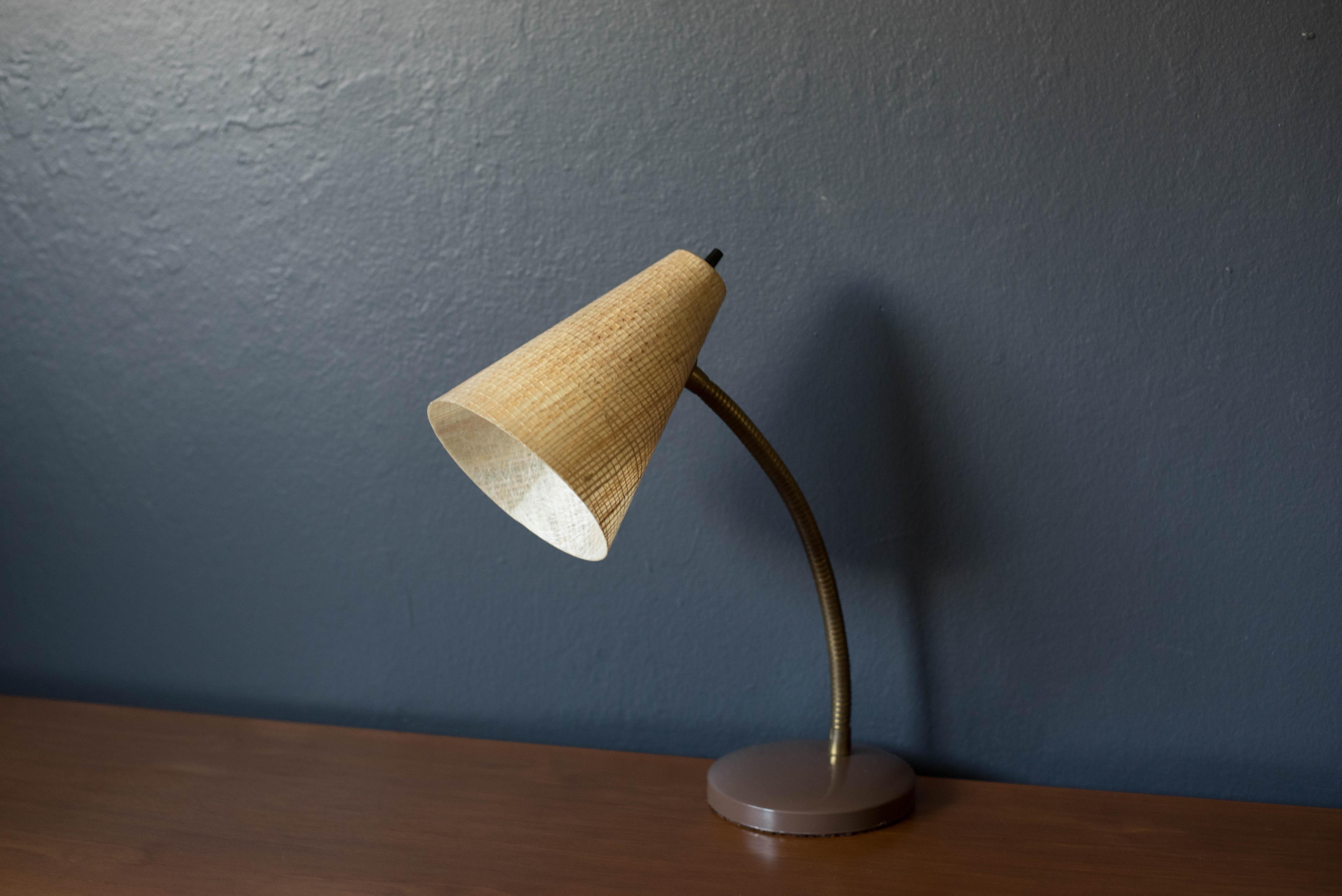 Vintage task lamp with fiberglass cone shade, circa 1970s. This versatile piece adjusts at the head and stem and works great as an office or desk light.


Offered by Mid Century Maddist