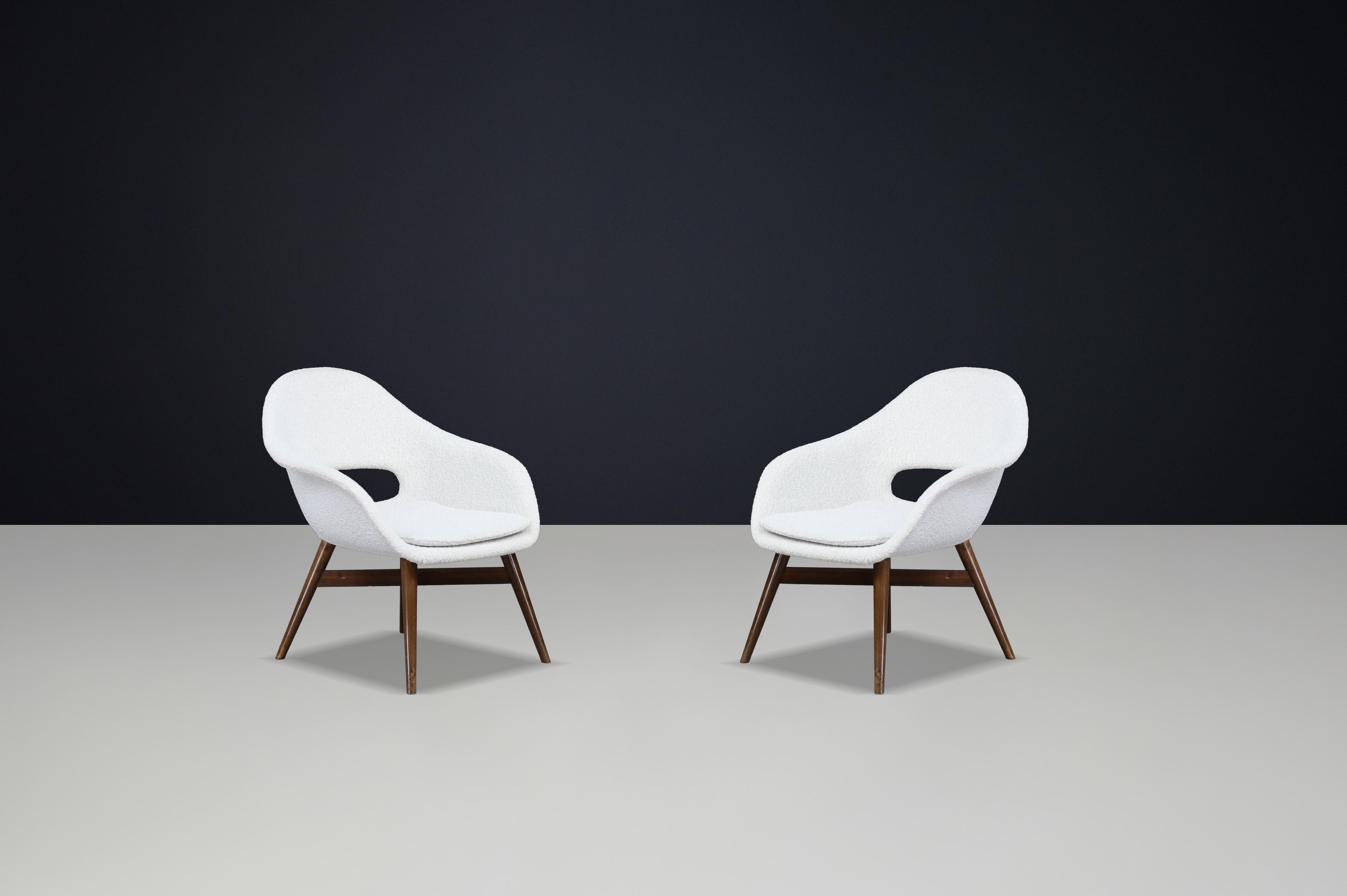 Mid-Century Fiberglass Easy Chairs by Miroslav Navrátil, Czechoslovakia 1960s

Set of 2 — Professionally reupholstered in bouclé

These sculptural fiberglass easy chairs were designed by Miroslav Navrátil in Czechoslovakia during the 1960s. Their