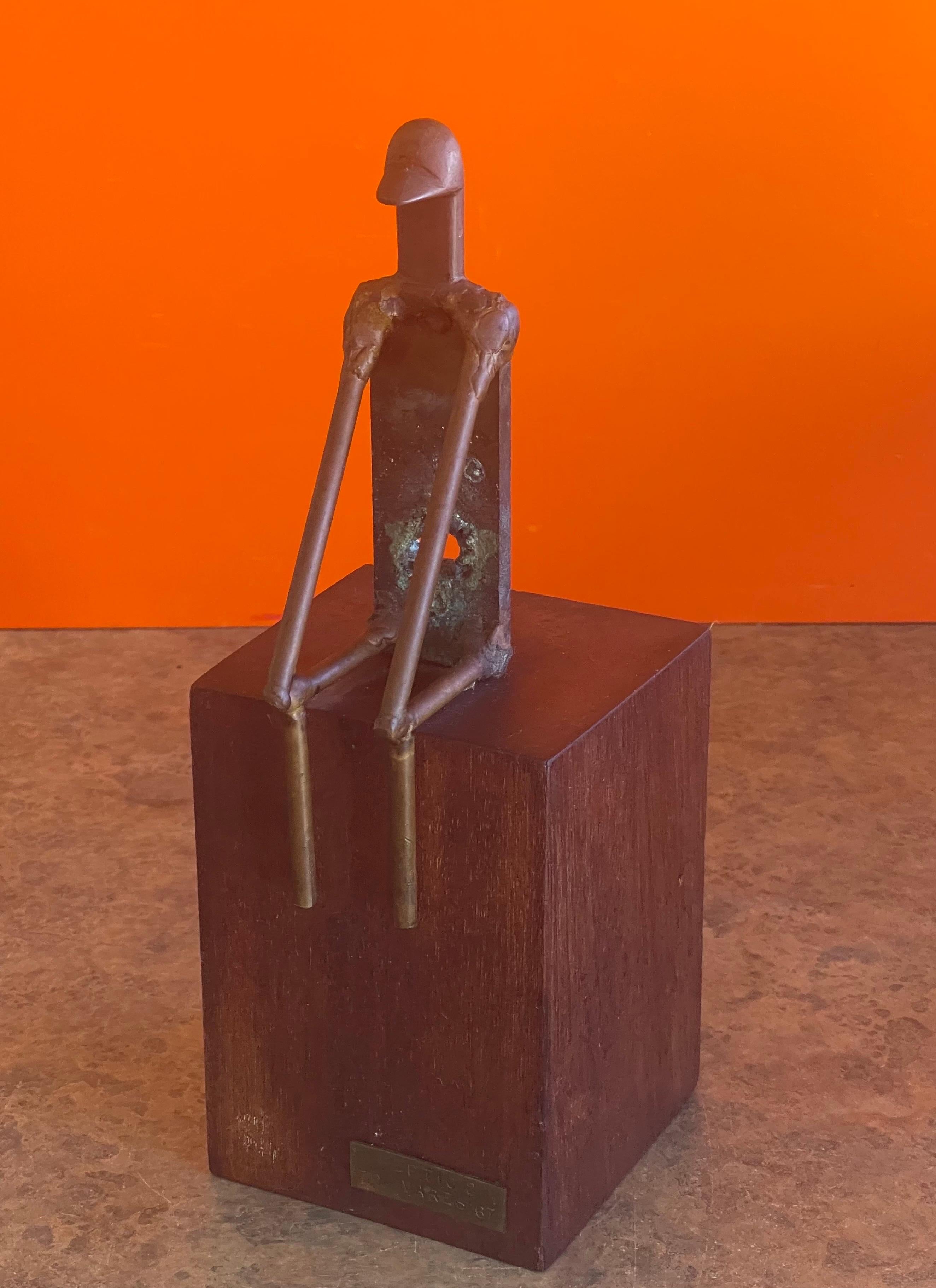 Mid-century figural sculpture on solid walnut base entitled 