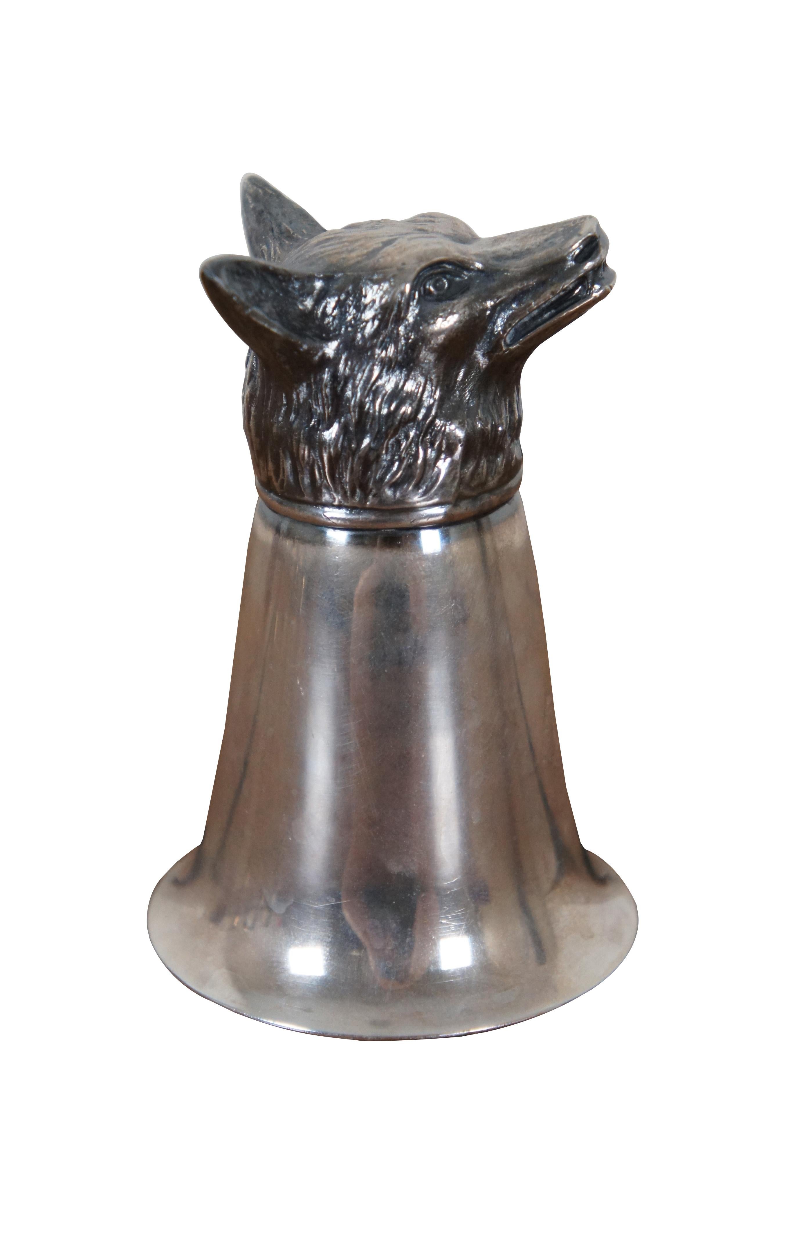 Mid-20th Century silver plate jigger topped with a wolf’s head. Monogrammed with the initials CHV.