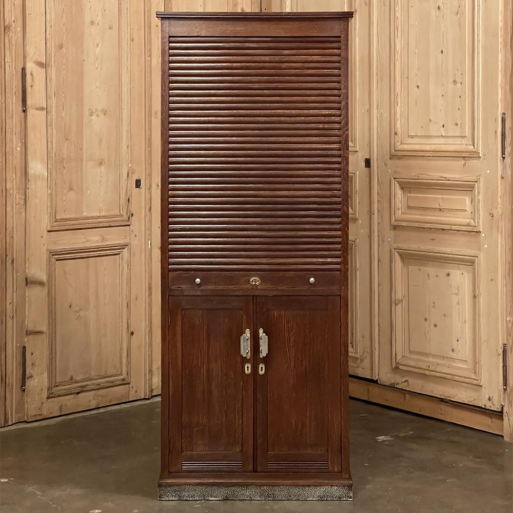 Mid-century file cabinet with roll-up tambour door was designed to be incredibly versatile, allowing one to organize a wide variety of files, folders, music, even more collectible items! The traditional cabinet below opens like any other, with three