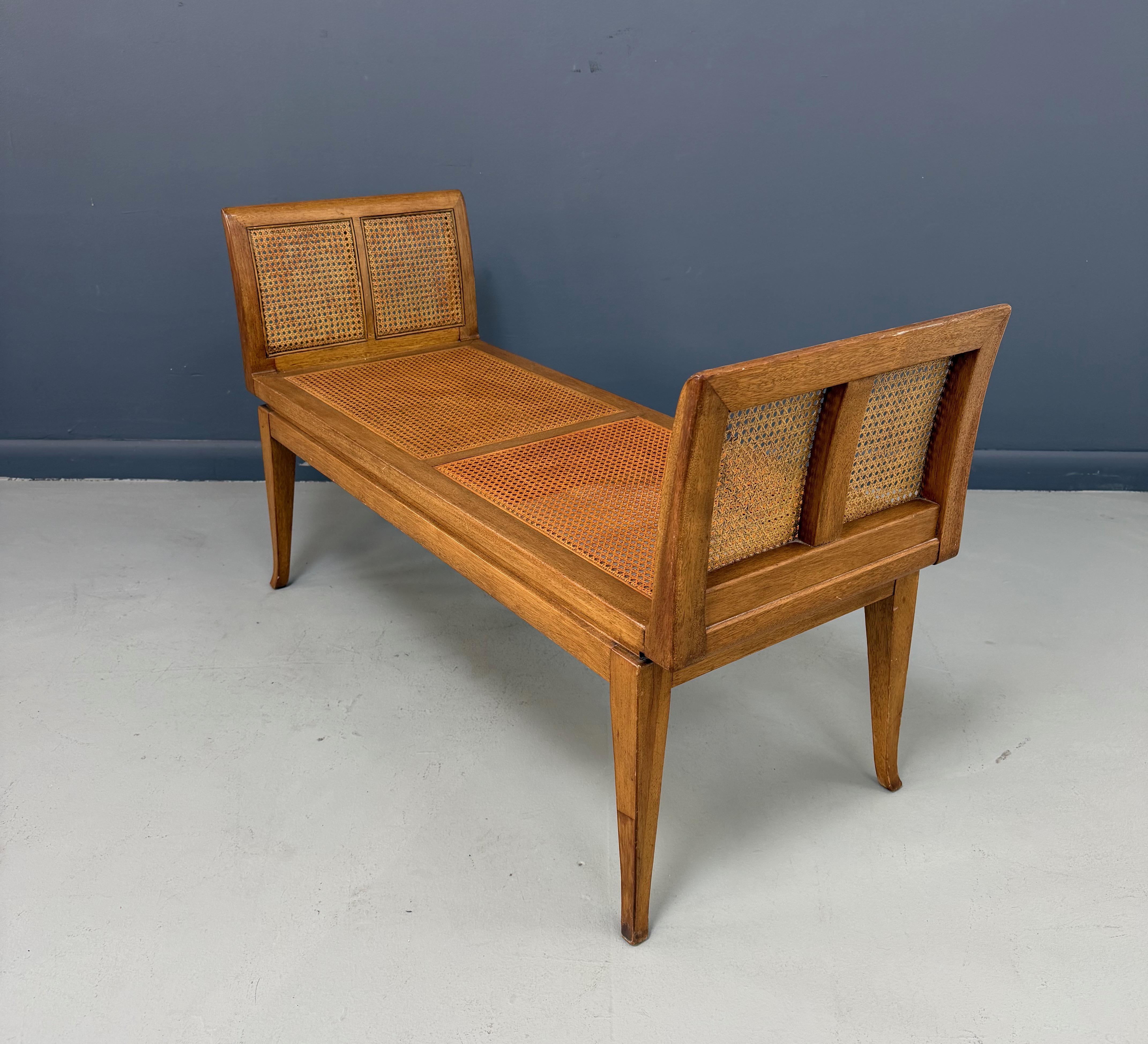 A beautifully crafted mid-century bench by Fine Arts Furniture, featuring the brand’s signature blend of refined lines and durable materials. This elegant piece showcases a blond mahogany frame with warm, honeyed tones, complemented by expertly