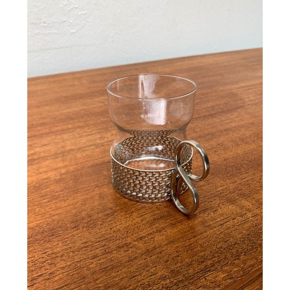 Mid-Century Finnish Tsaikka Tea Glass by Timo Sarpaneva for Iittala, in Very Good conditions. Designed 1950 to 1959 Official proof of authenticity such as vintage catalogs, designer records.

Additional information:
Materials: Glass, Metal
Color:
