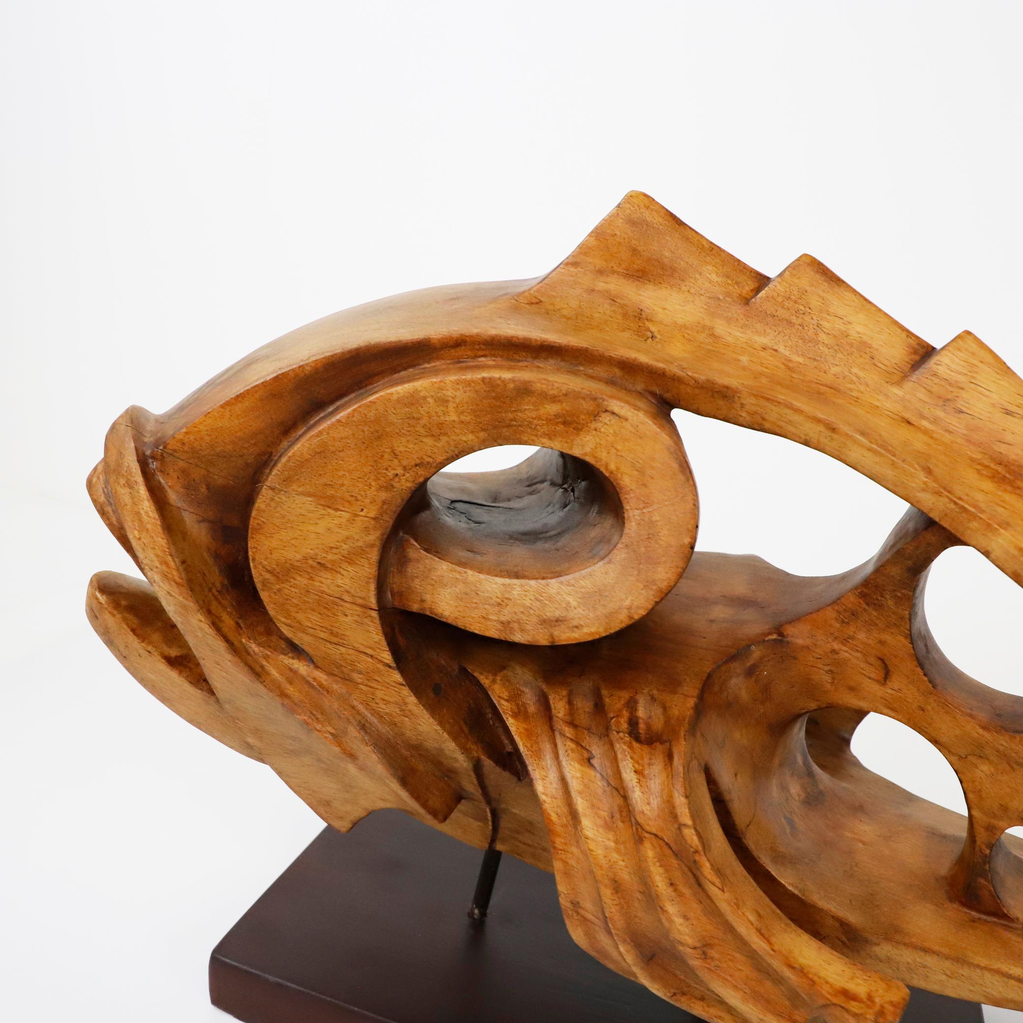 Circa 1960. We offer this mid century fish sculpture in tropical carved wood.