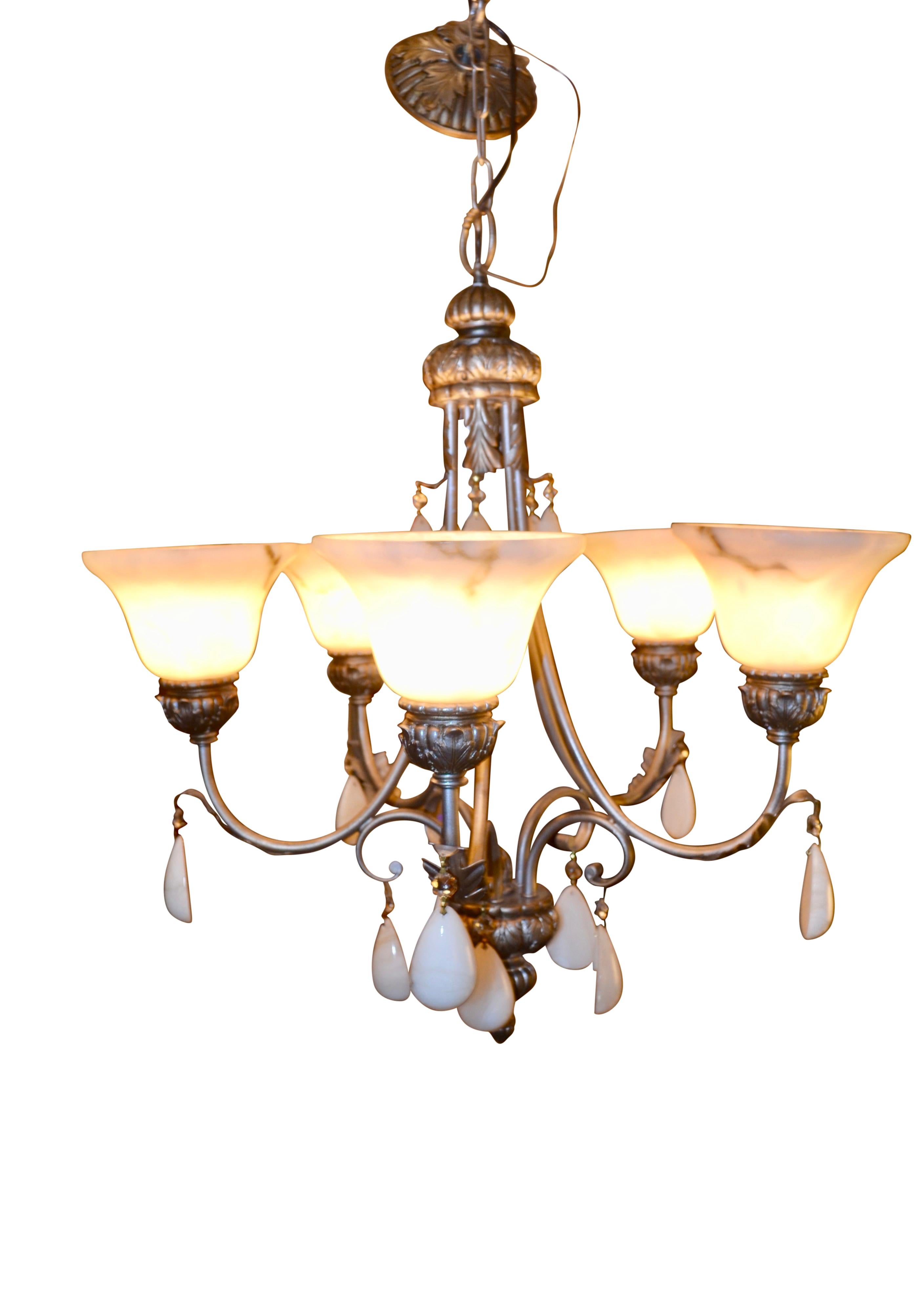 This five arm chandelier with a simple silvered metal frame features five alabaster/composition shades, and is hung with tiers of genuine white marble pendants. It has been recently re-wired.   