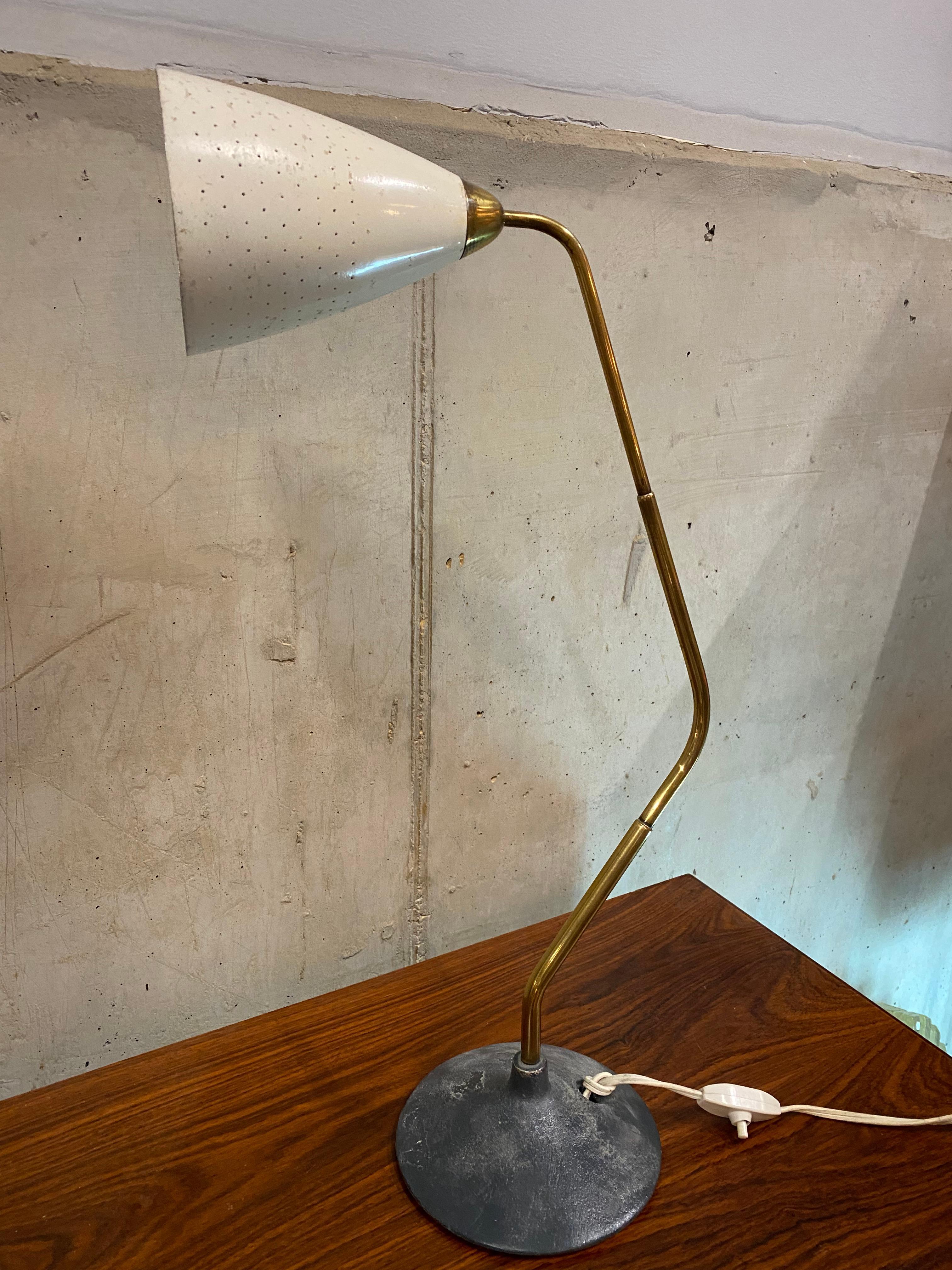Flamingo table lamp designed by Karl Hagenauer for Hagenauer from the 1940s Karl Hagenauer designed this wonderful lamp for his Hagenauer workshops. The reduced design makes the lamp made of brass with creamy white perforated shade. Hagenauer