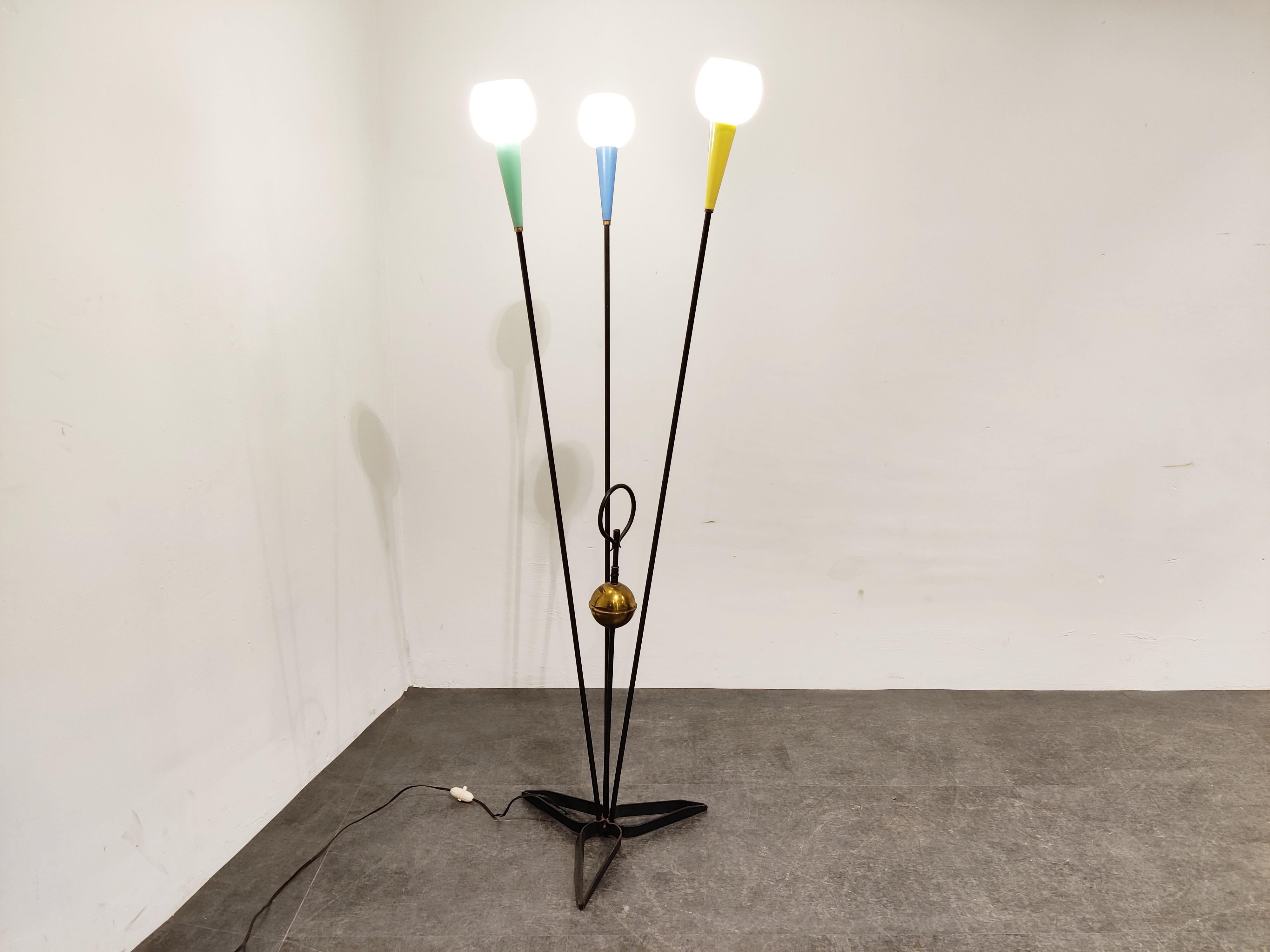 Mid century floor lamp with three coloured lamp shades and white glasses.

Eye catching designwith a brass center sphere.

Good condition.

Works with regular E14 sized light bulbs.

1960s, Belgium

Dimensions:
Height