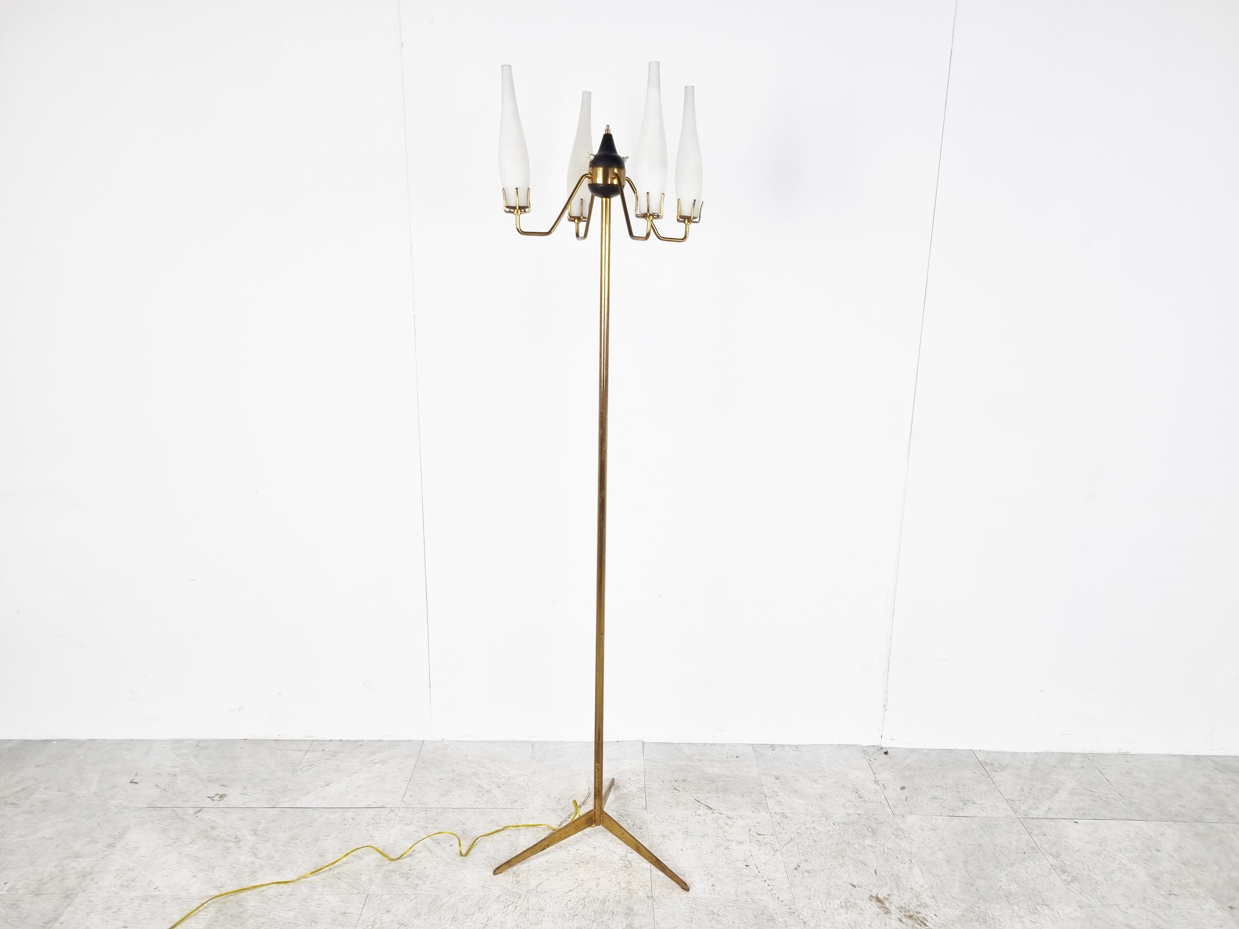 Mid century floor lamp with a brass tripod base and 4 beautiful original white glass lamp shades. 

The lamp was manufactured by Italian company Stilux Milano, commonly their lamps are attributed to Stilnovo.

Eye catching design with beautiful