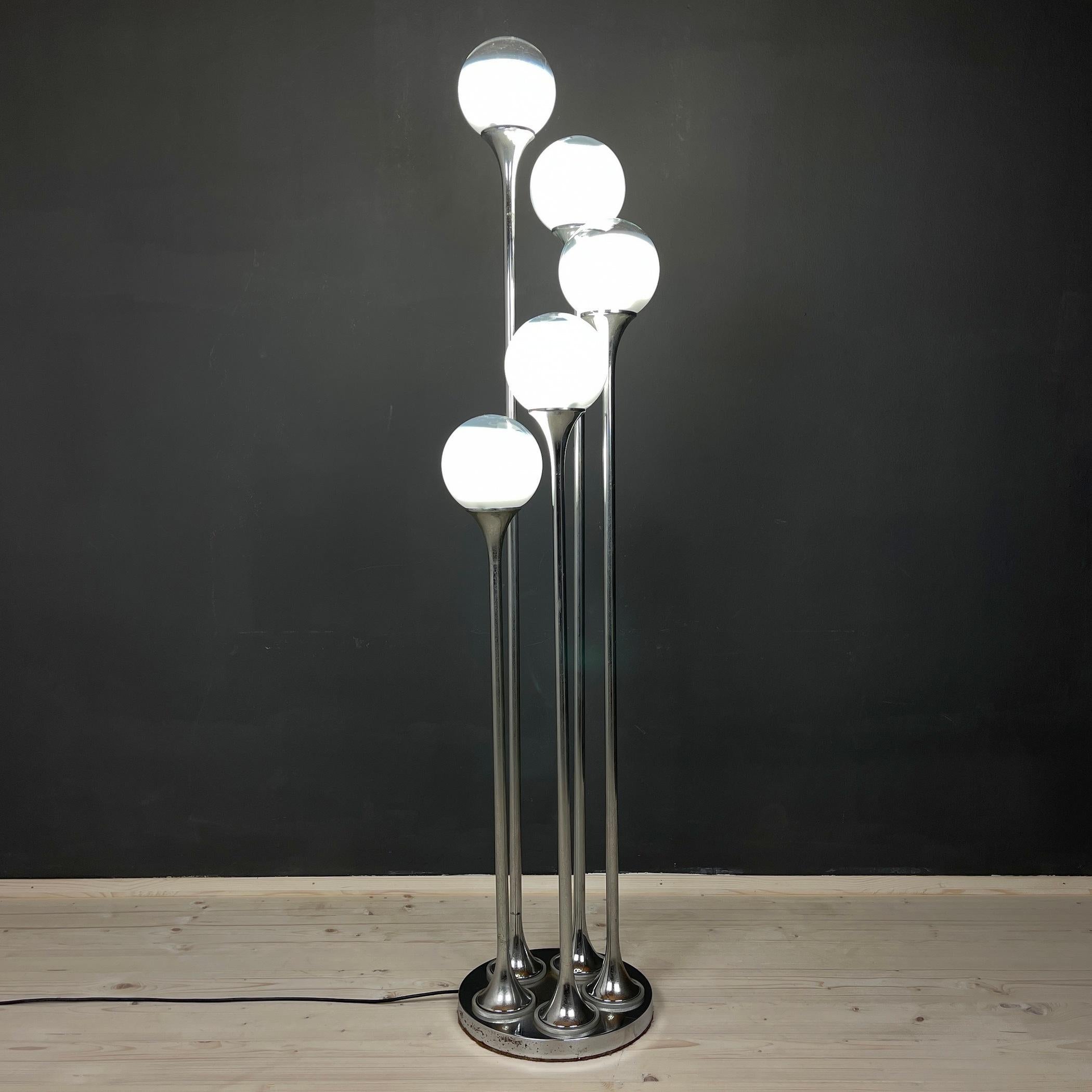 Midcentury floor lamp by Targetti Sankey made in Italy in the 1960s The glass components are constructed of blown Murano glass. The lamp has a unique and uncommon shape. This brilliantly captures the mid-century aesthetic and the spirit of the space