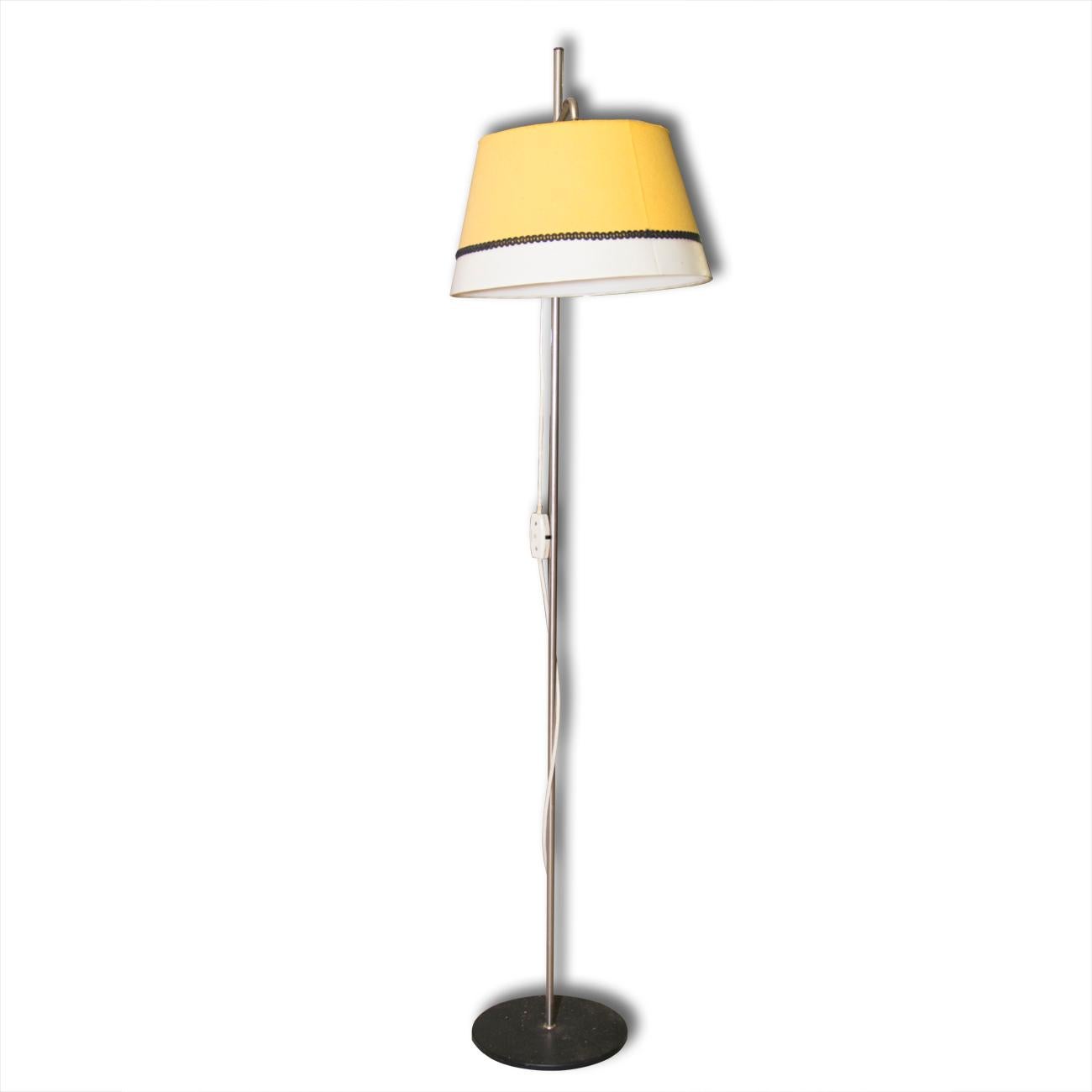 Midcentury vintage metal floor lamp, it was made in Czechoslovakia in the 1960s. he lamp features the slender leg, chrome-plated construction and a fabric shade. This lamp is fitted with one bulb E27 and has an original wiring.

 