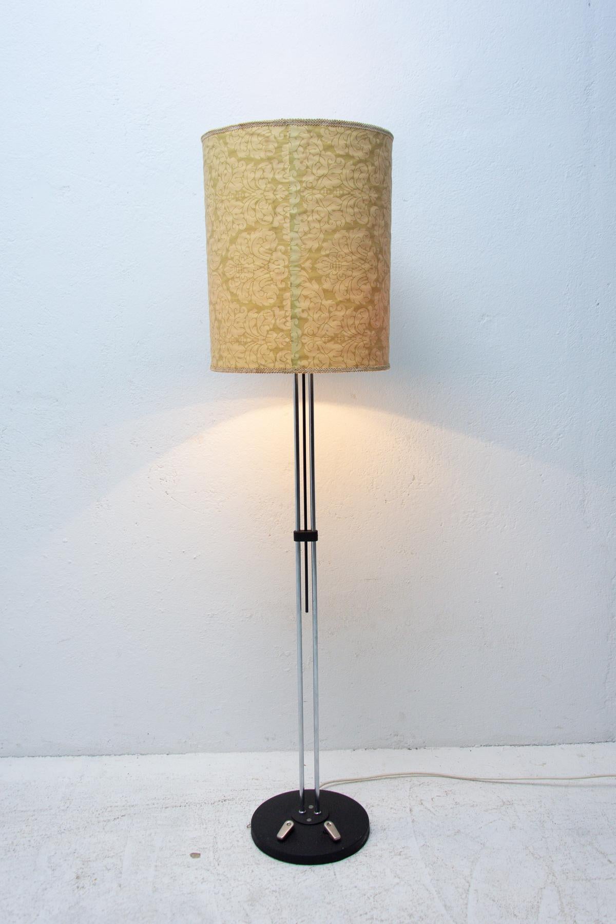 Stylish floor lamp made in the 70s by Lidokov company in the former Czechoslovakia. It has a metal stand, plastic and fabric shade and two switches located on the base. This lamp is equipped with one E27 bulb and has new wiring.
 