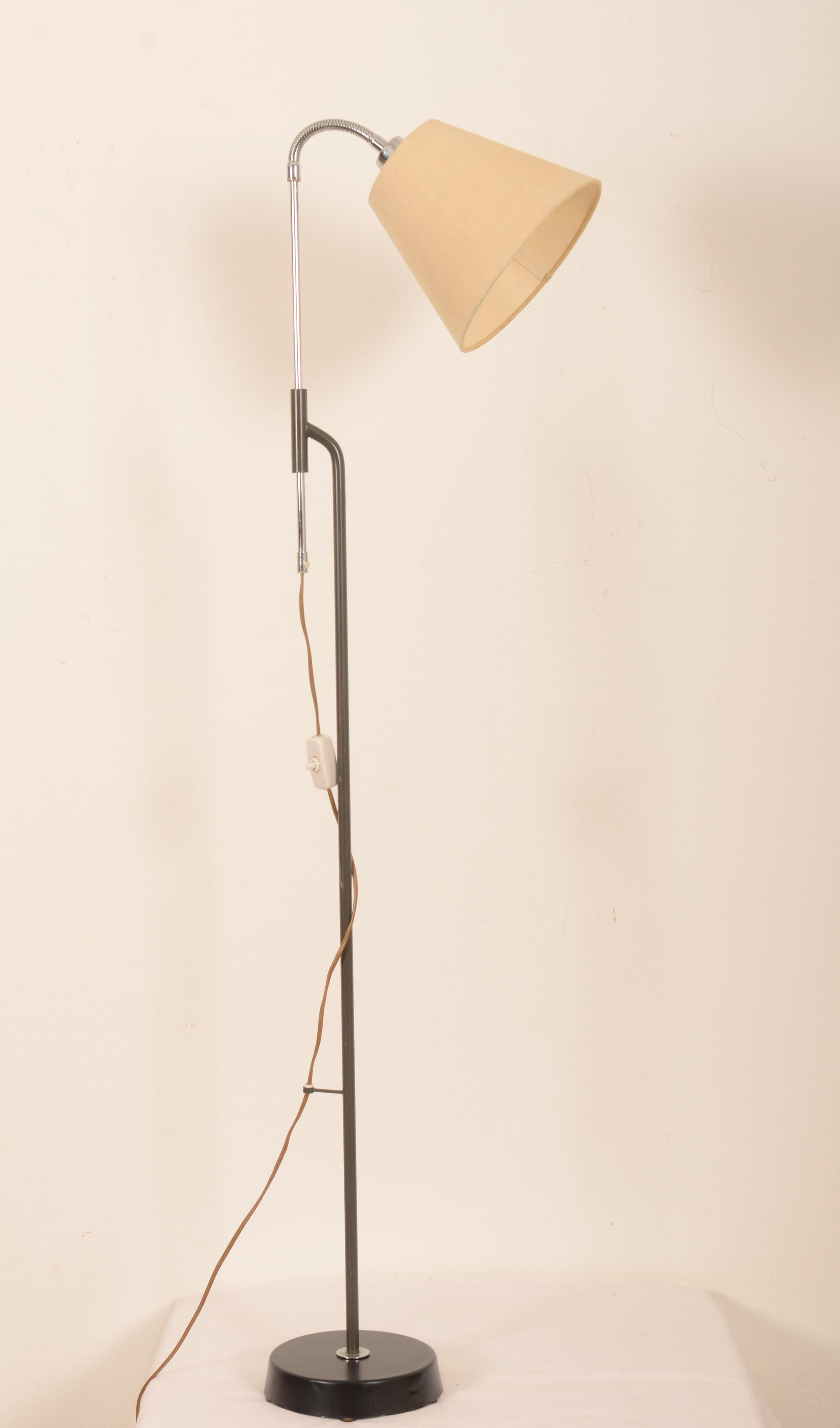 Cast iron base, arm with goose neck fitted with E27 bakelite sockets and cream lamp shades. Designed in Sweden in the 1960s.