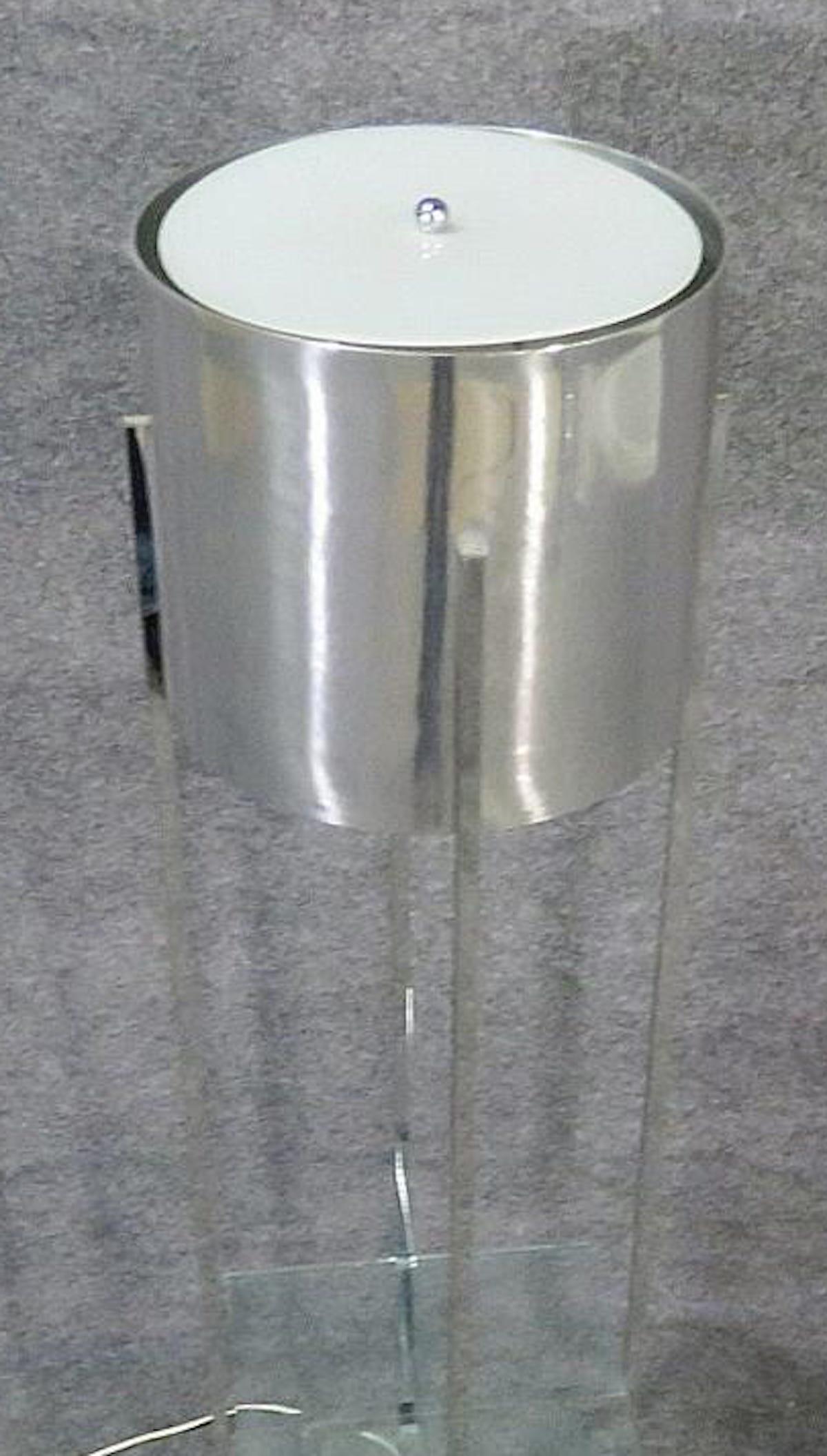 Tall chrome lamp with one glass shelf and silver shade.
(Please confirm item location - NY or NJ - with dealer).
 