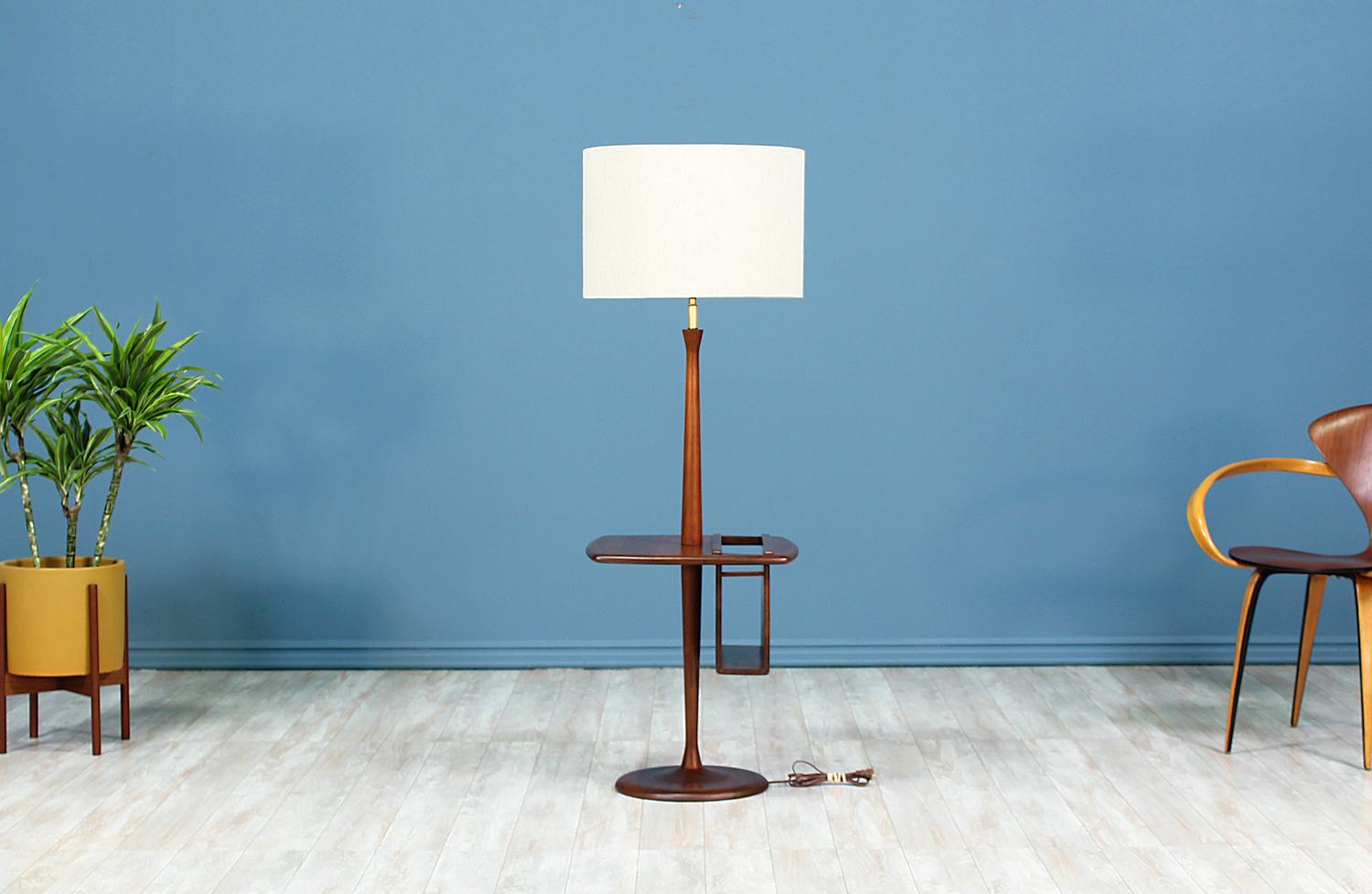 Floor Lamp designed and manufactured by Laurel Lamp Co. in the United States circa 1960’s. This beautiful Mid-Century Modern lamp features a tall walnut wood body with beautiful grain detail. A versatile and exclusive design that supports a small