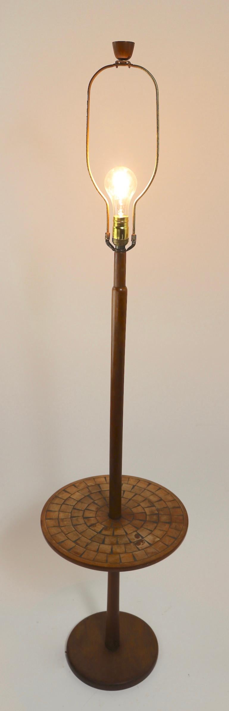 Classic Mid Century floor lamp, with inlayed mosaic style squares of wood radiating out from the center pole on the disk table surface. Nice original, working condition, showing only cosmetic wear to finish, normal and consistent with age. Possibly