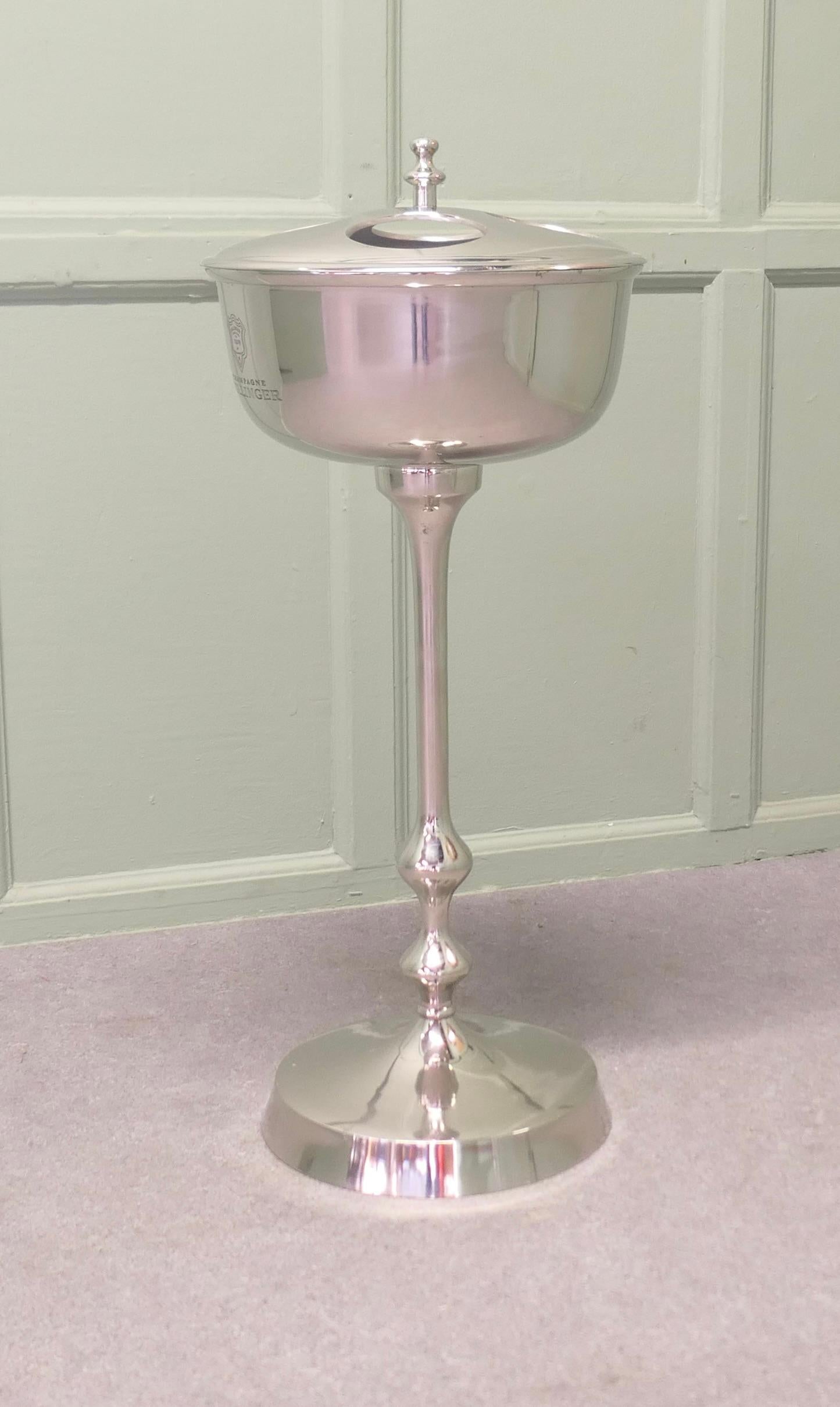 Mid  Century Floor Standing Chrome Champaign Ice Bucket 

This is a charming piece it stands on a central column and has provision for 4 bottles in the reservoir at the top

The stand is in good condition, it is 32” tall, and 14” in diameter 
TGY138
